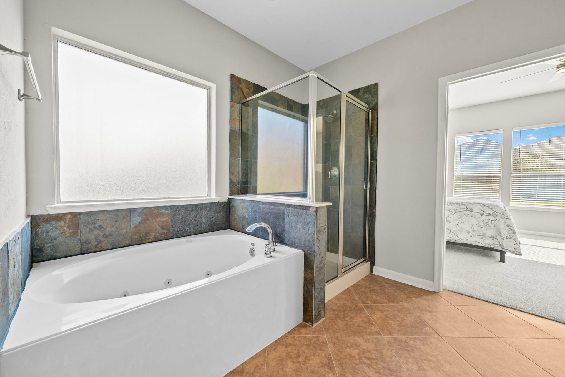 8523 Sweetstone Field Court, Cypress, TX 77433 Primary bath featuring soaking tub and separate shower.