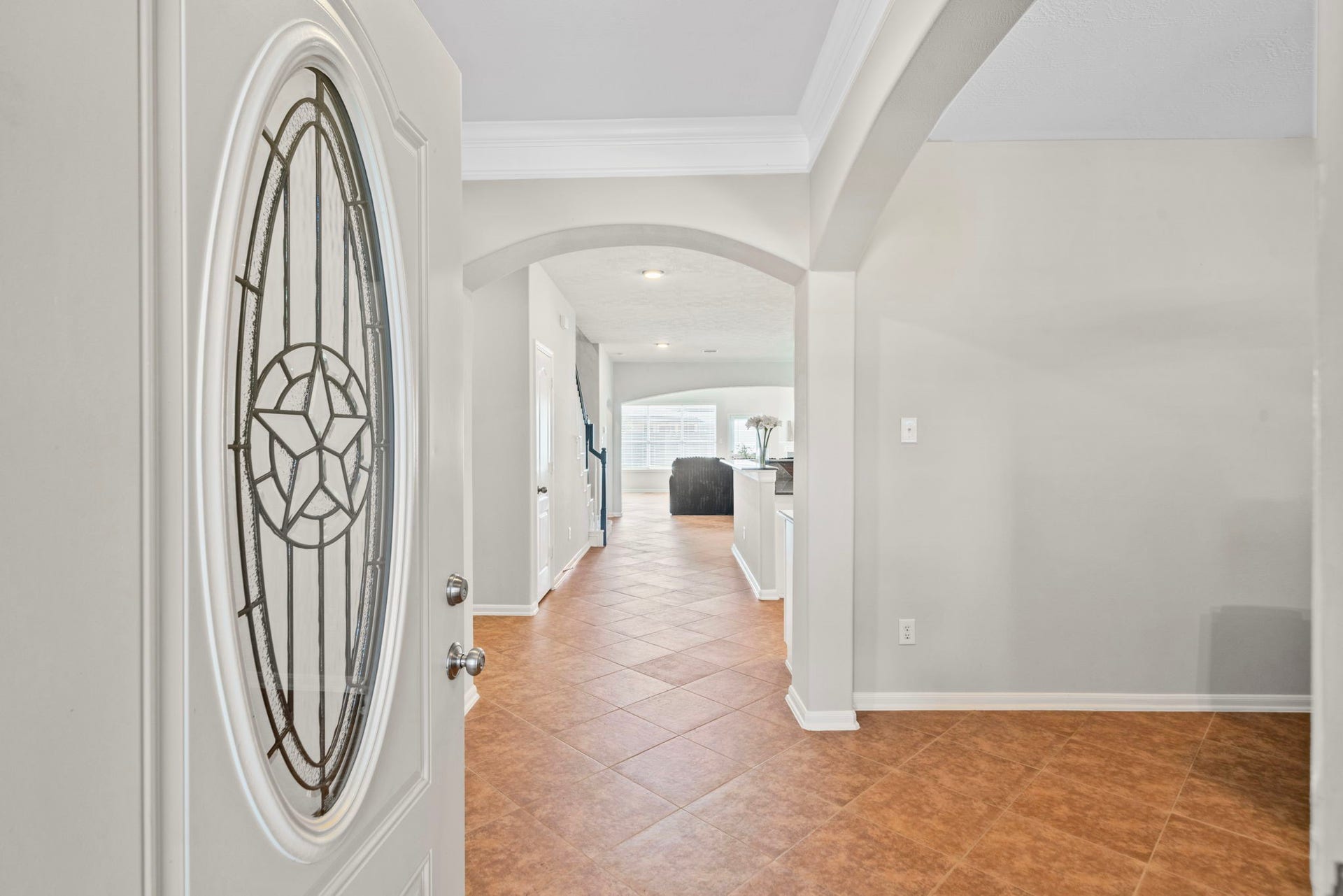 8523 Sweetstone Field Court, Cypress, TX 77433 Elegant entry with beautiful front door and welcoming foyer.