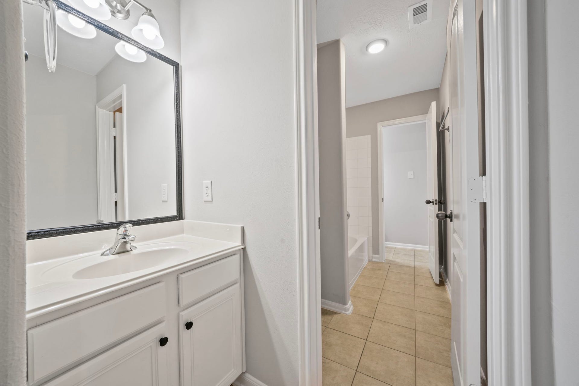 8523 Sweetstone Field Court, Cypress, TX 77433 Additional vanity area in Hollywood-style bathroom.