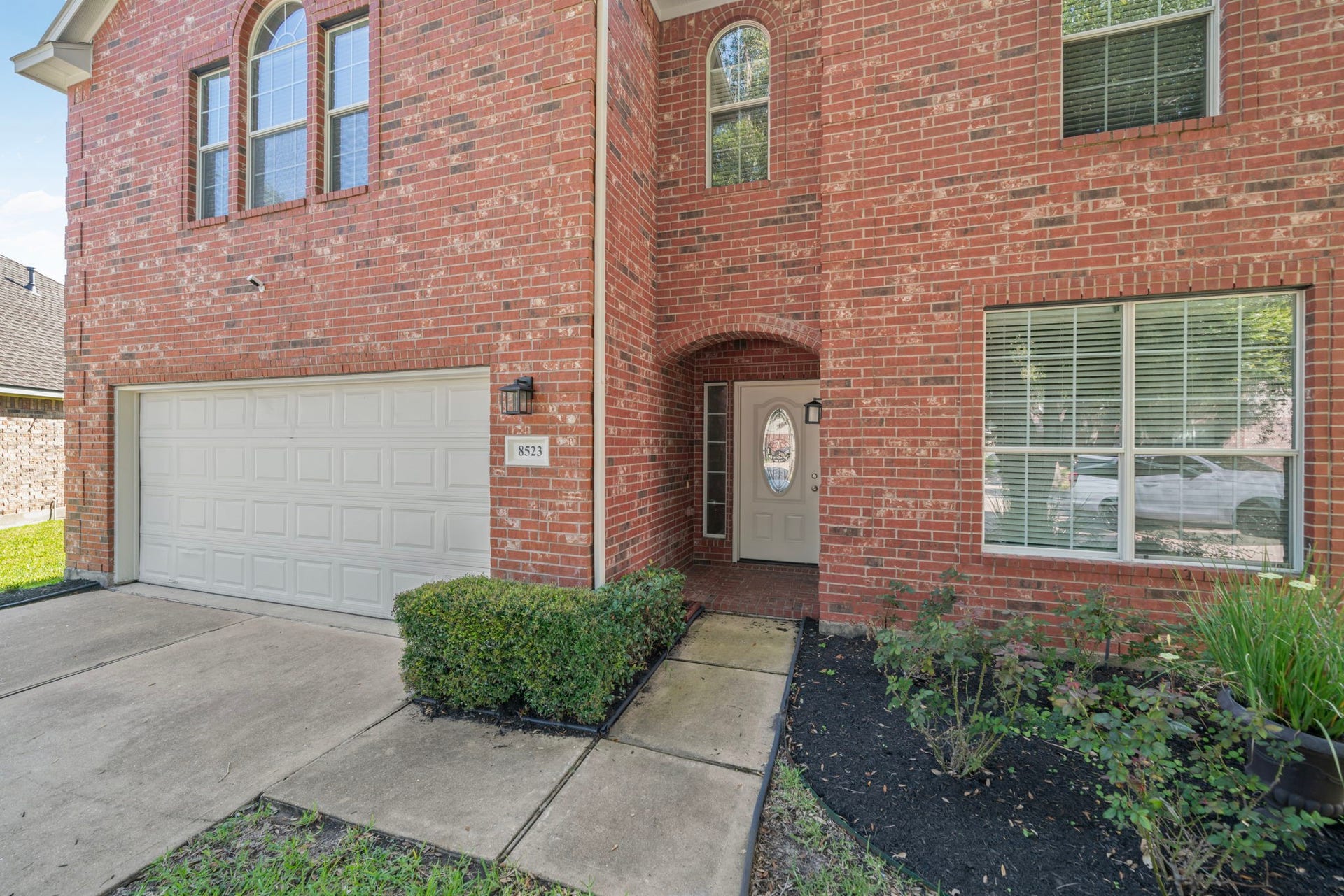 8523 Sweetstone Field Court, Cypress, TX 77433 Beautiful brick elevation with welcoming front entrance.