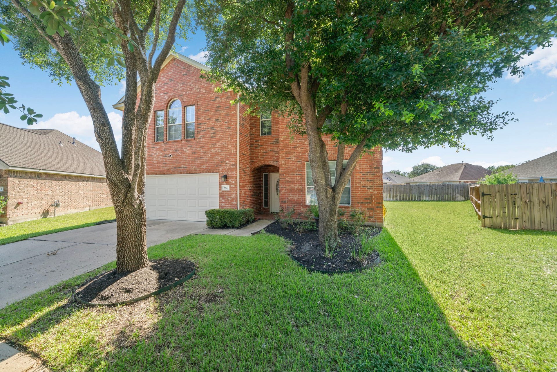 8523 Sweetstone Field Court, Cypress, TX 77433 Large corner-style lot with mature trees and extra outdoor space.
