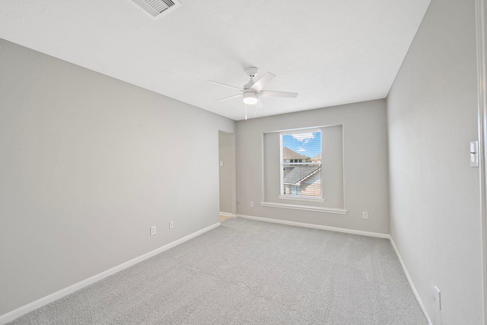 8523 Sweetstone Field Court, Cypress, TX 77433 Spacious secondary bedroom with natural light.