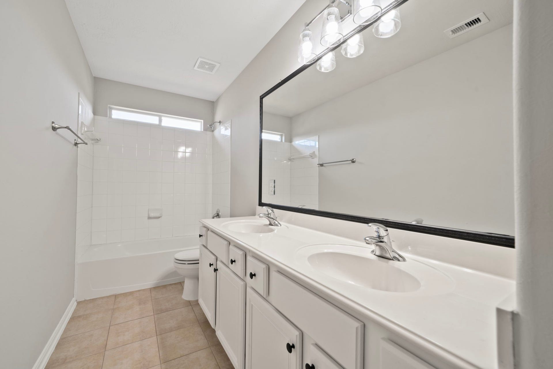 8523 Sweetstone Field Court, Cypress, TX 77433 Secondary bathroom with double sinks.