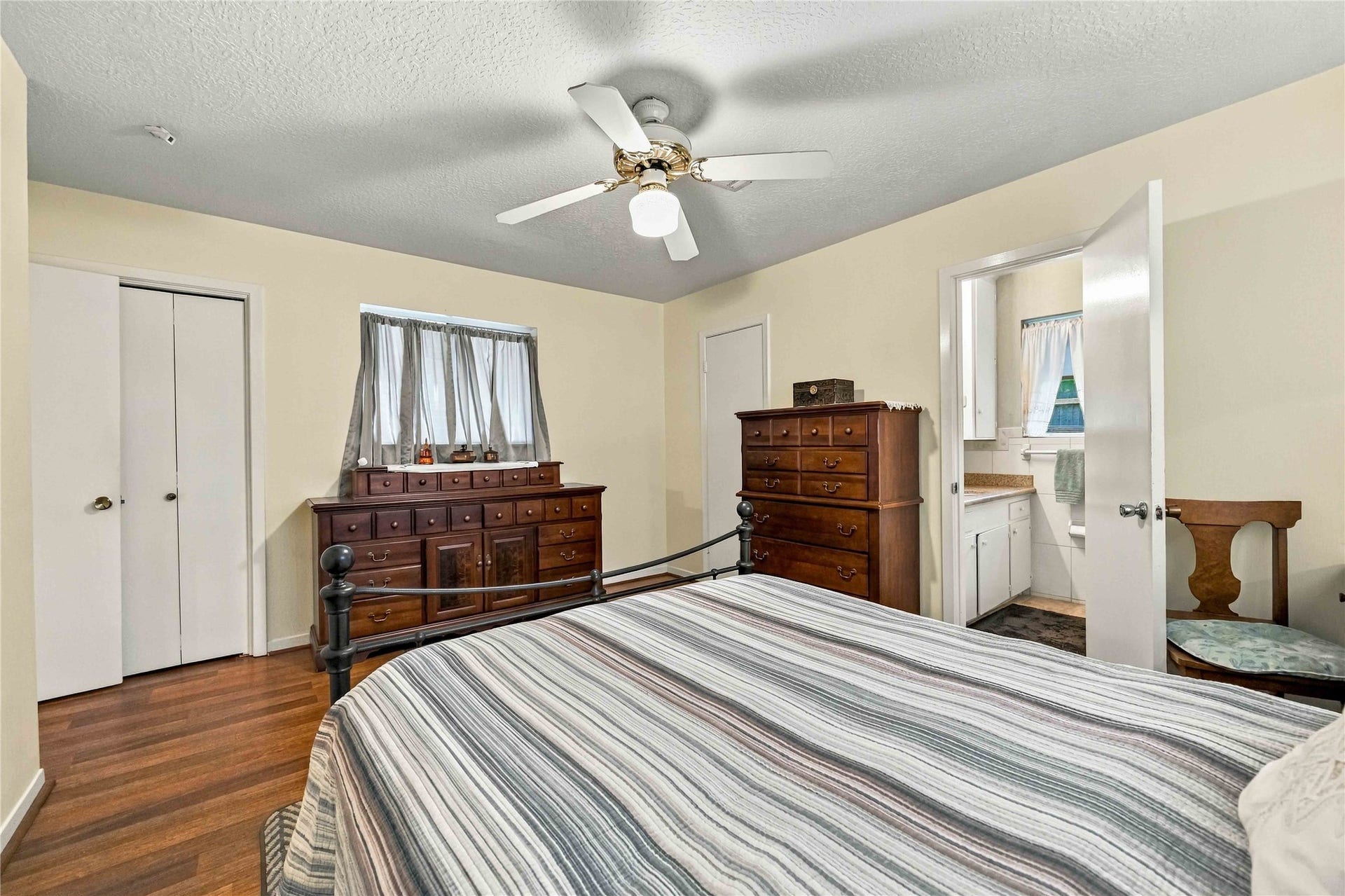 The primary suite highlights dual closets and access to the en-suite bath.