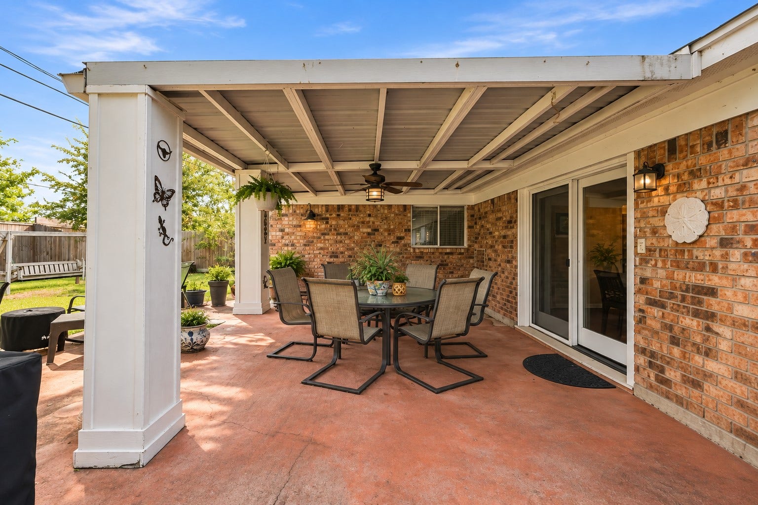 Step outside to the covered patio, perfect for relaxing, dining, or entertaining.