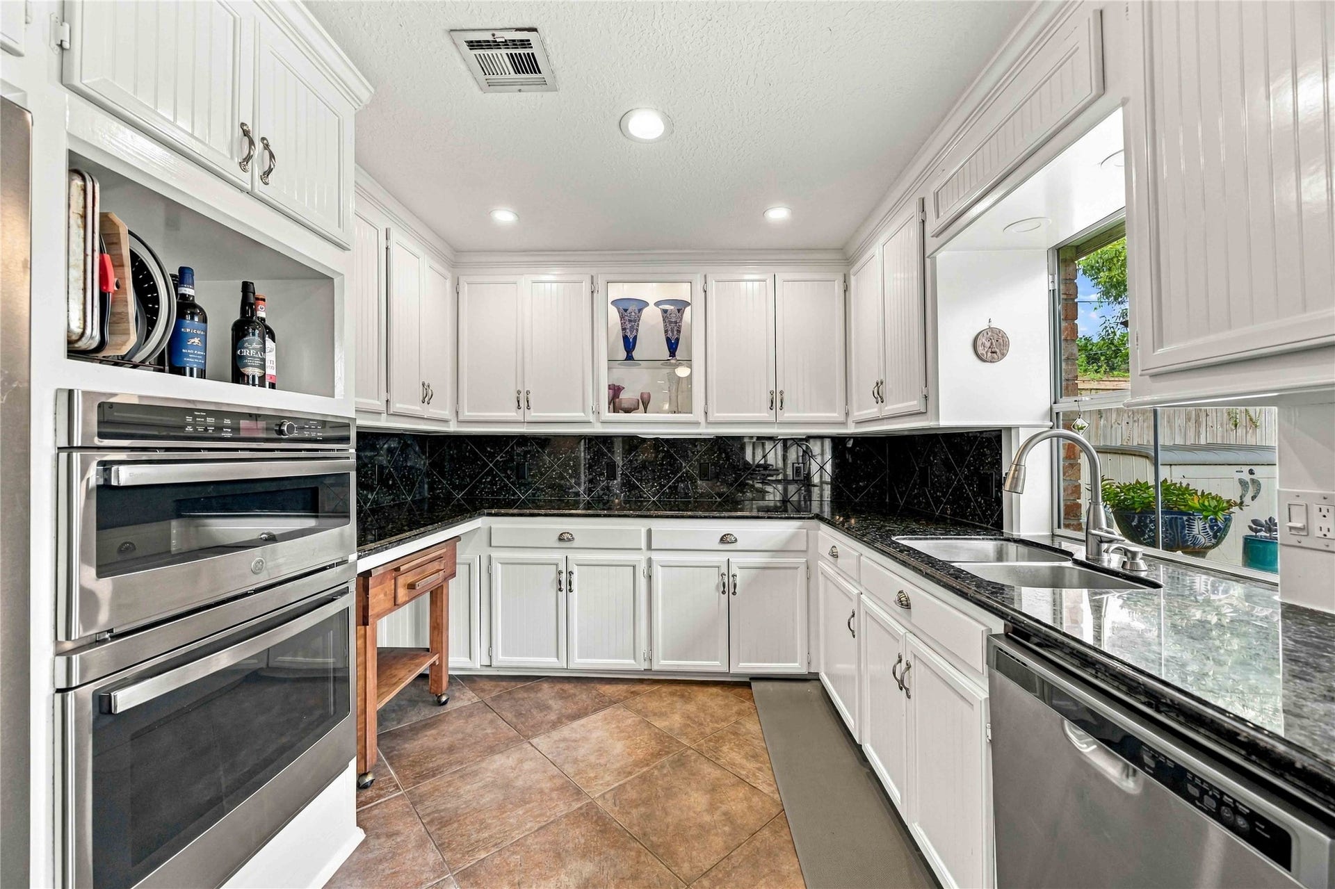 Generous cabinetry provides plenty of storage throughout the kitchen.