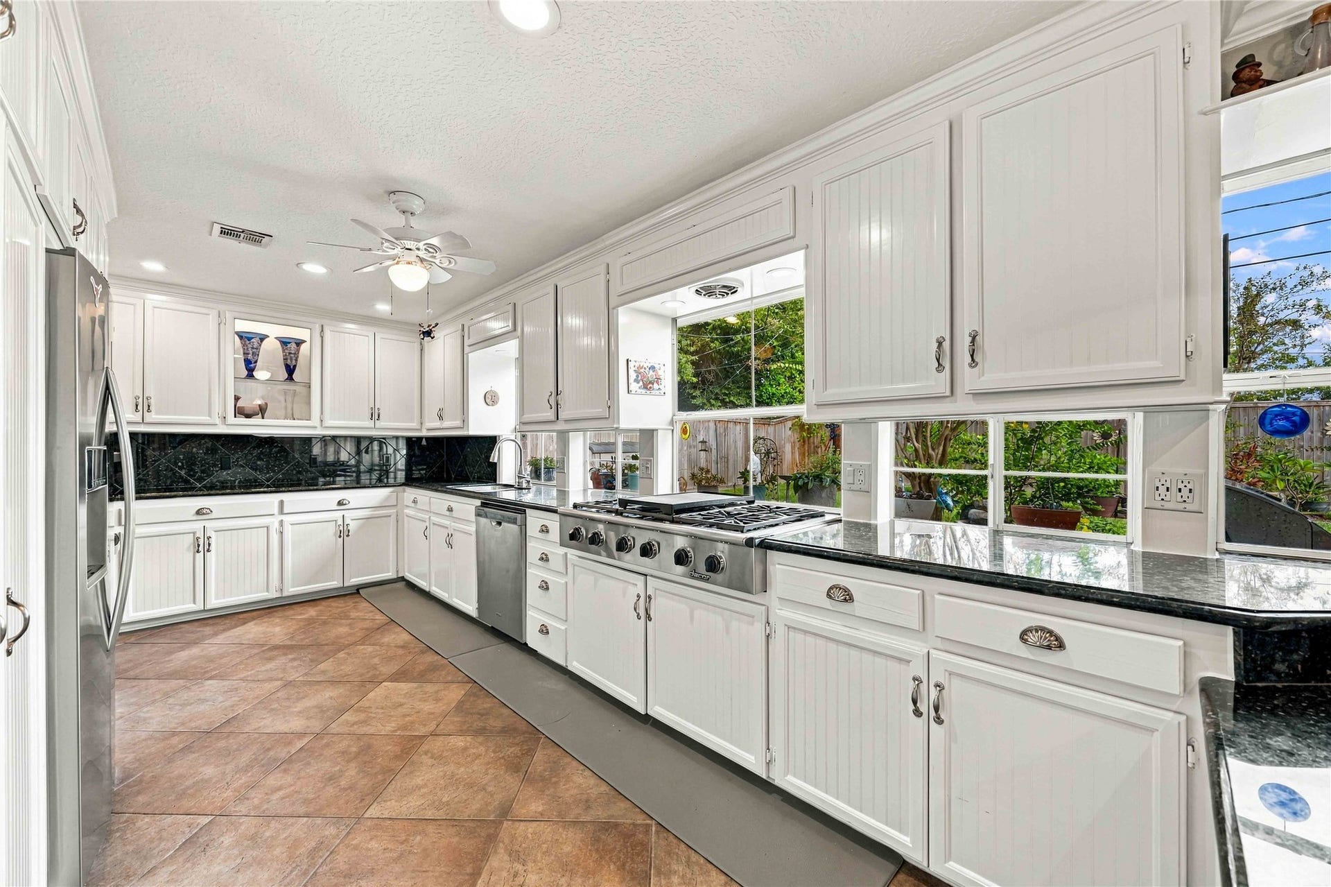 Granite countertops provide plenty of prep and workspace.