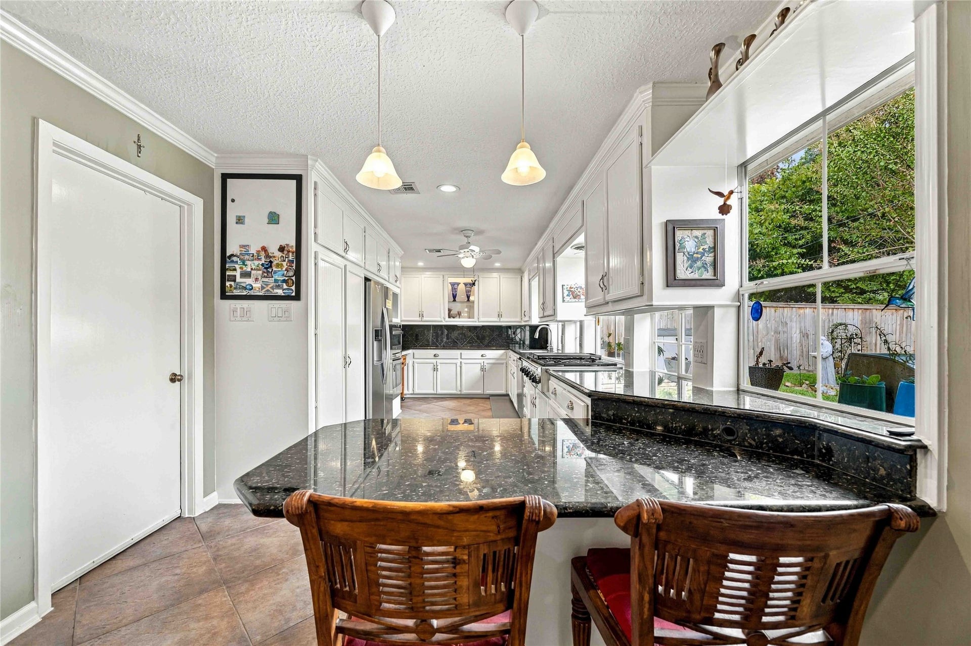 Breakfast bar offers additional seating and a casual spot for meals, coffee, or conversation.
