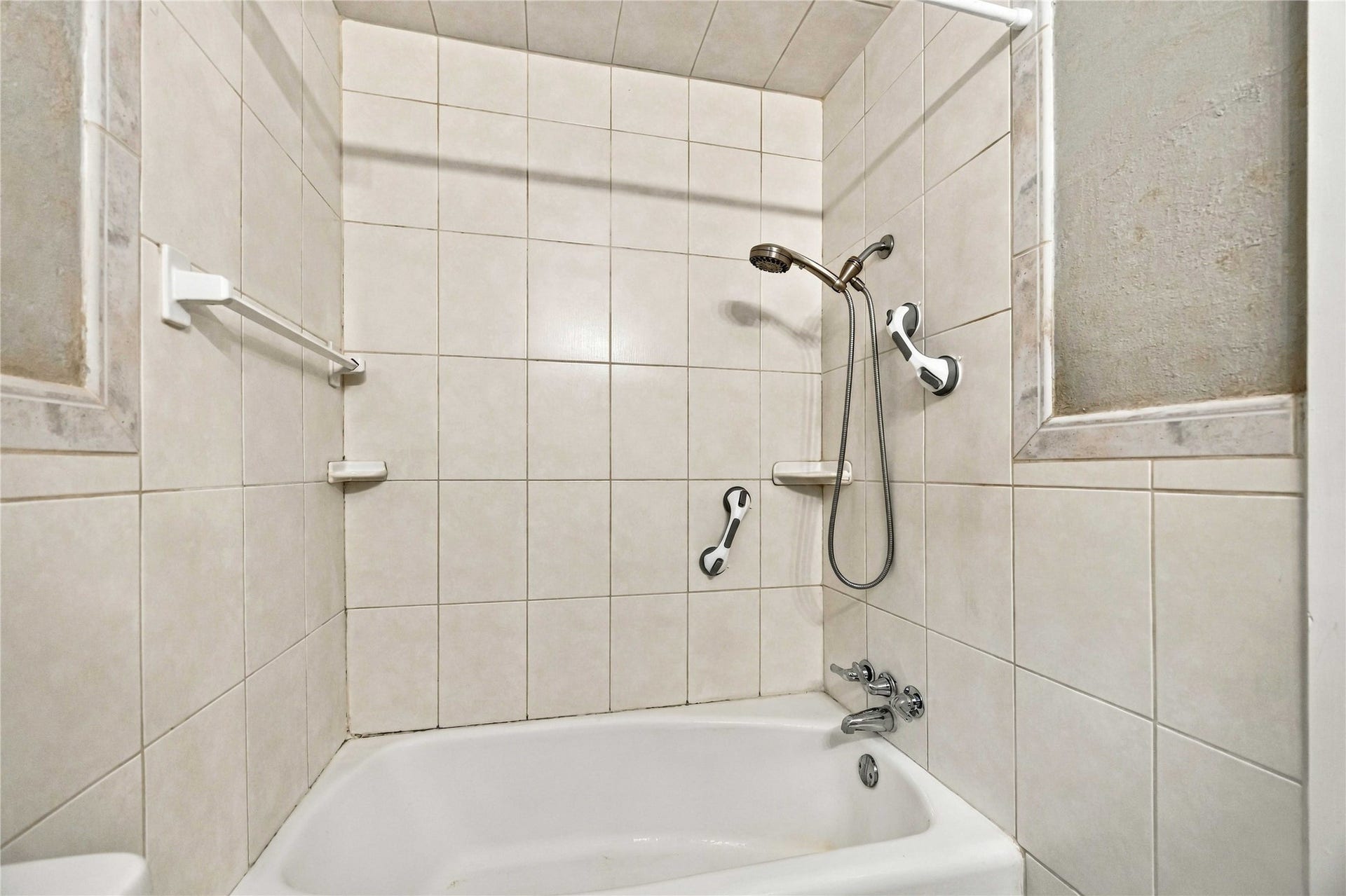 Tub/shower combination completes the private primary bath.