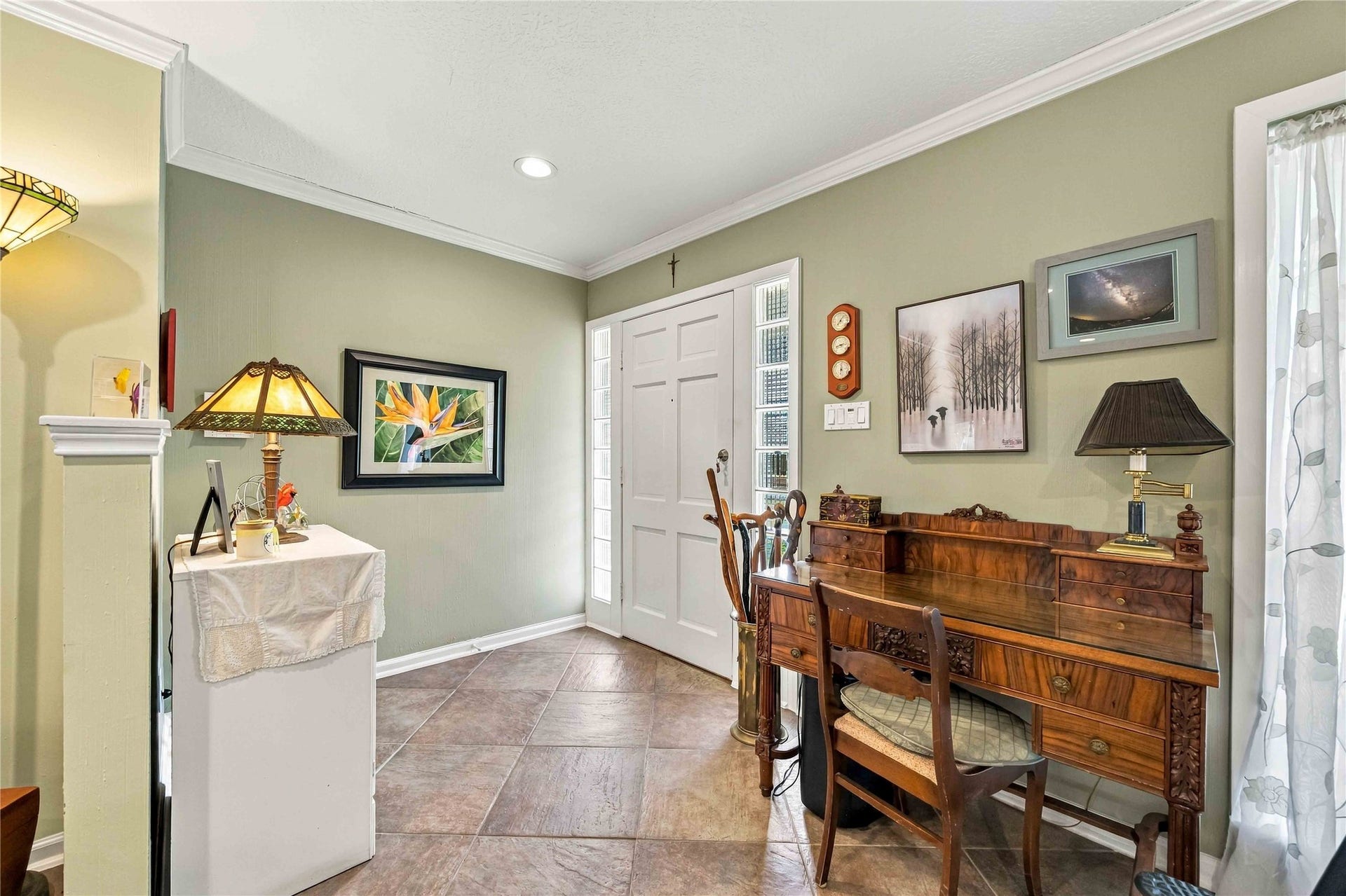 Welcoming entry leads into the main living area, offering a warm introduction to the home.