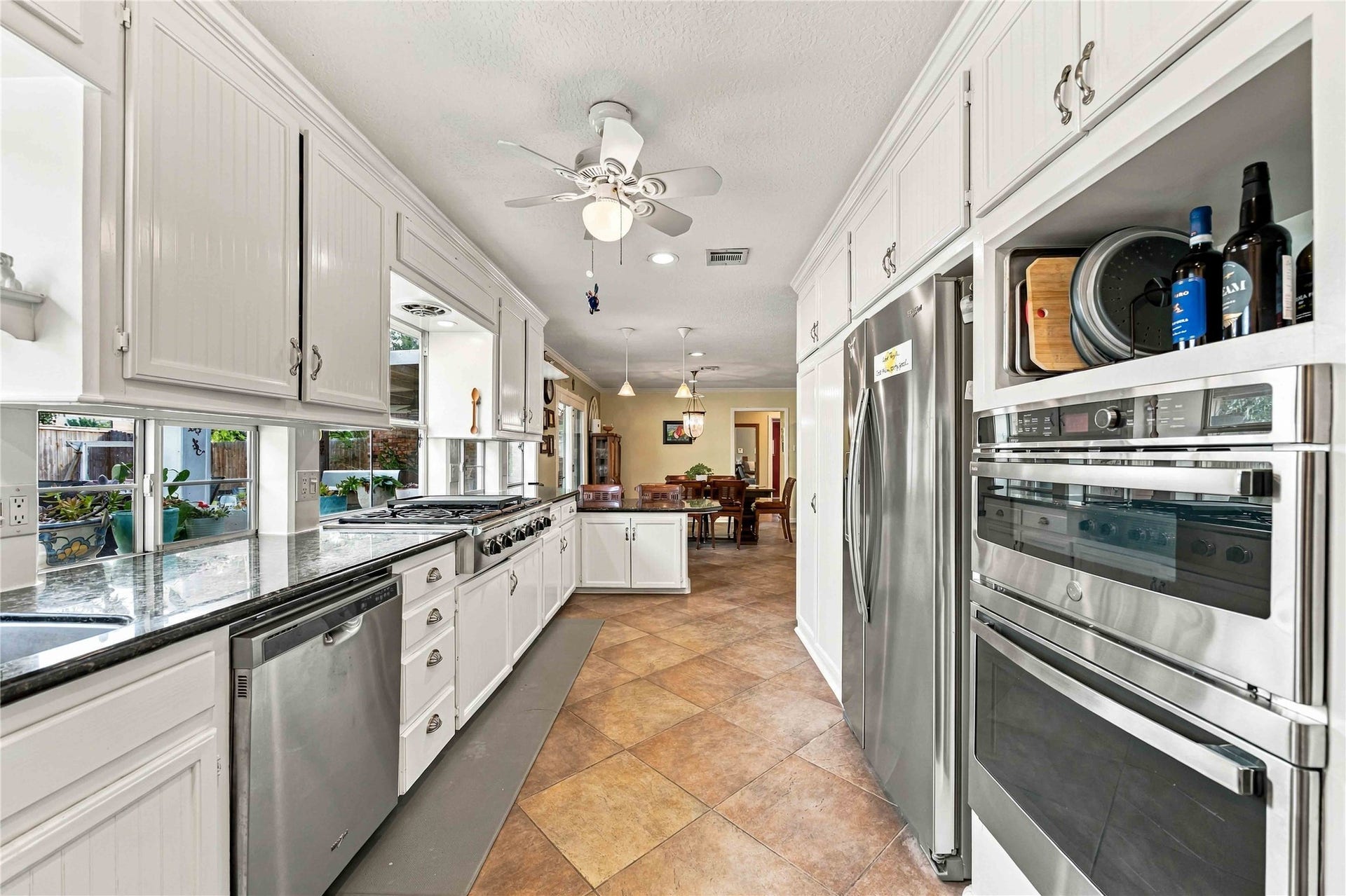 Stainless steel appliances complement the kitchens clean, functional design.