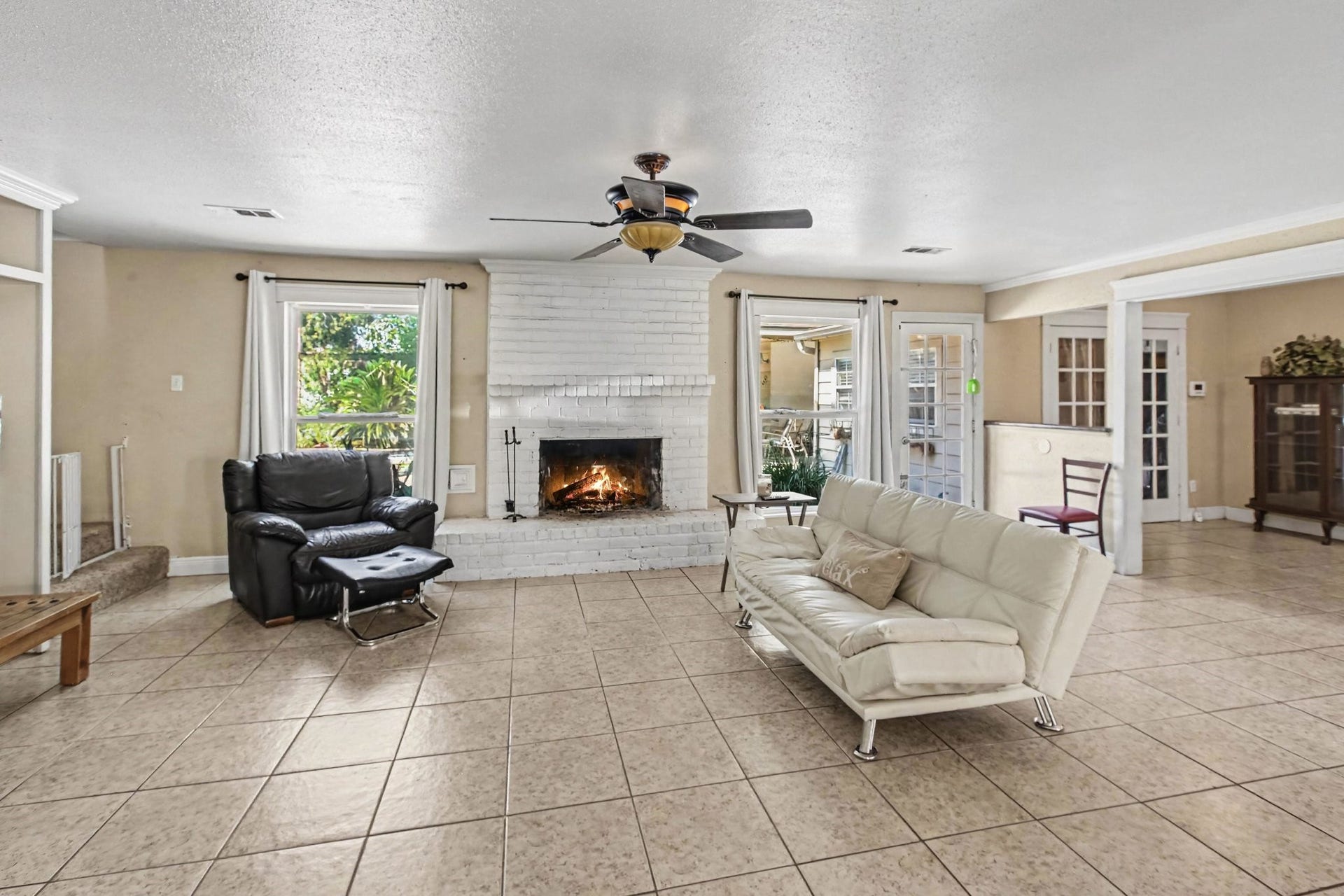The spacious main living room with fire place
