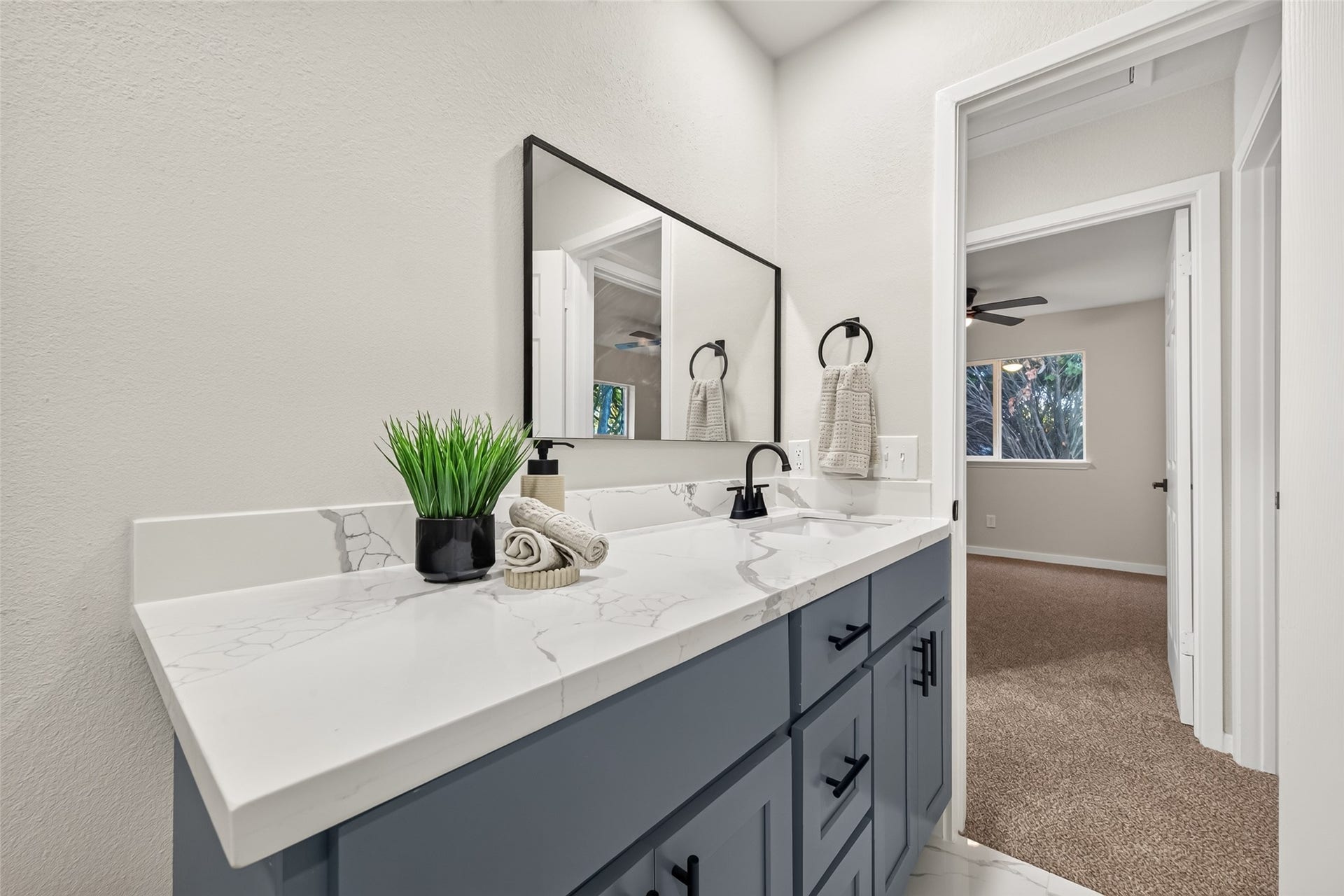 Spacious 2nd bath with all new modern finishes, floor to ceiling tiled standing shower