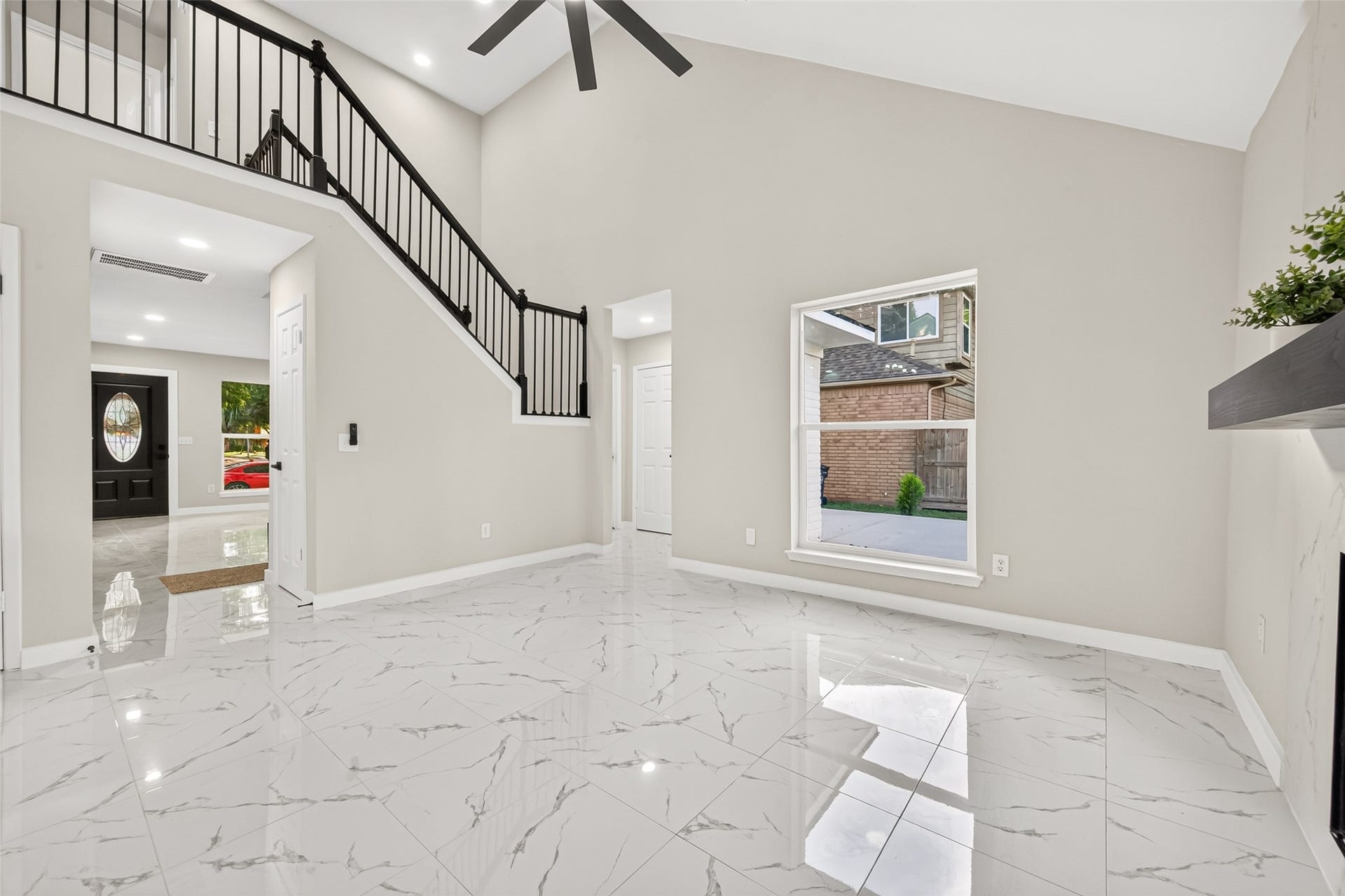 Open floor plan with high ceiling & lots of natural light