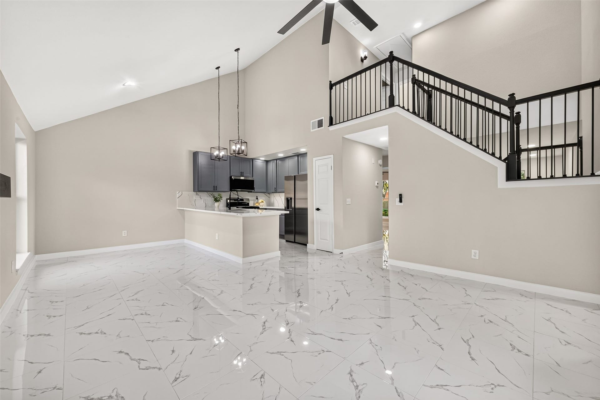 Open floor plan with high ceiling & lots of natural light