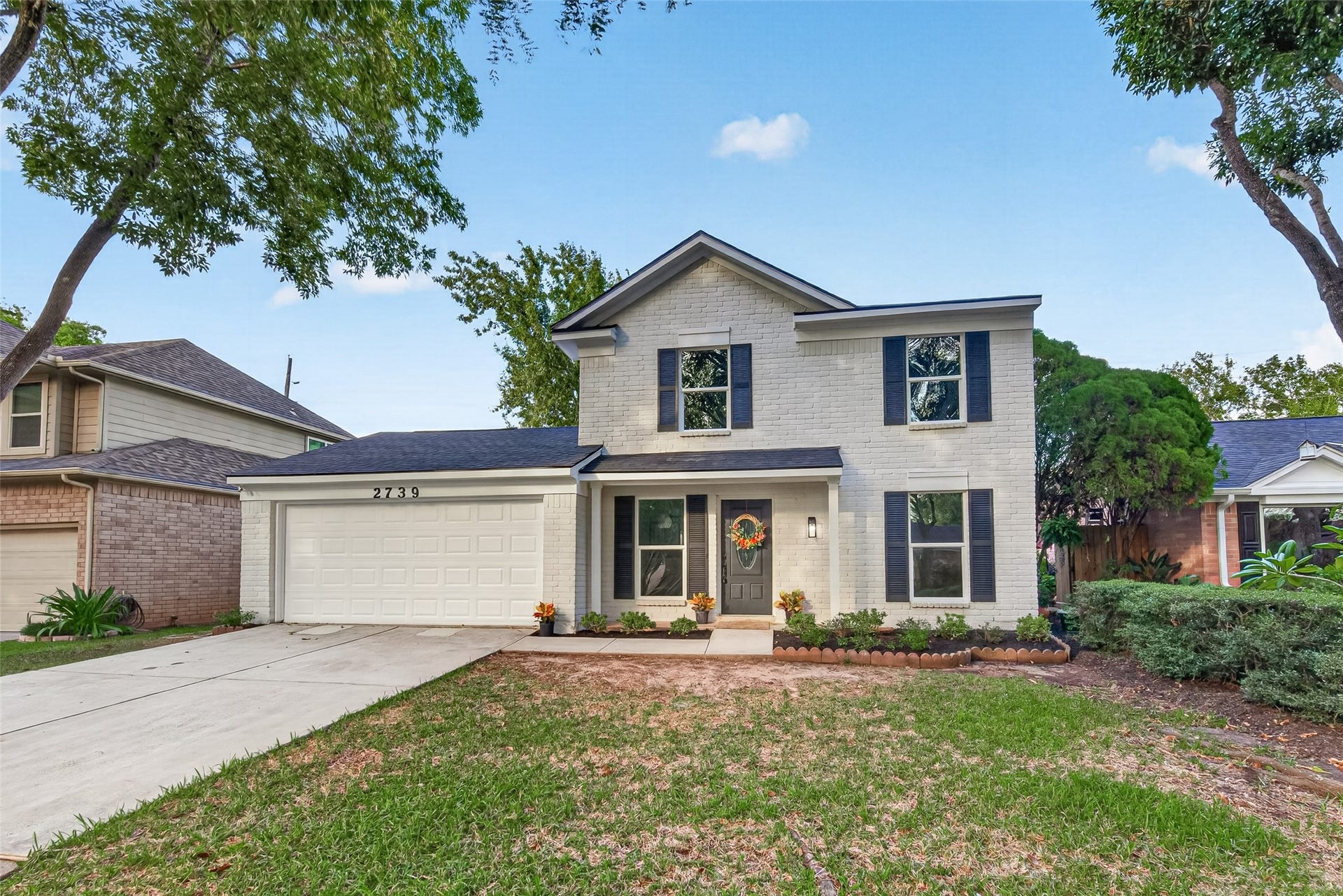 Beautiful curb appeal with fresh exterior paint, new roof, new windows & shutters as well as siding