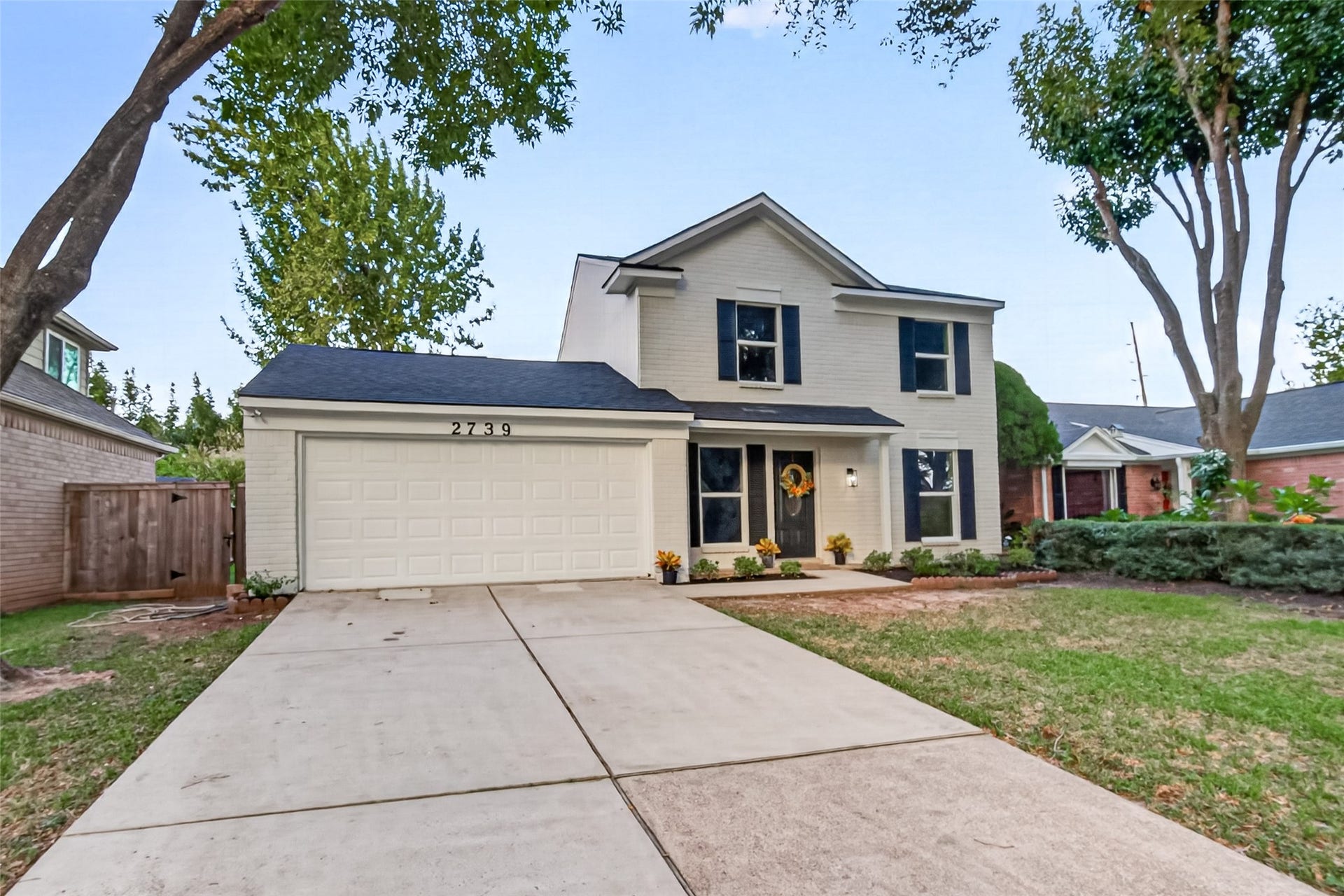 Beautiful curb appeal with fresh exterior paint, new roof, new windows & shutters as well as siding