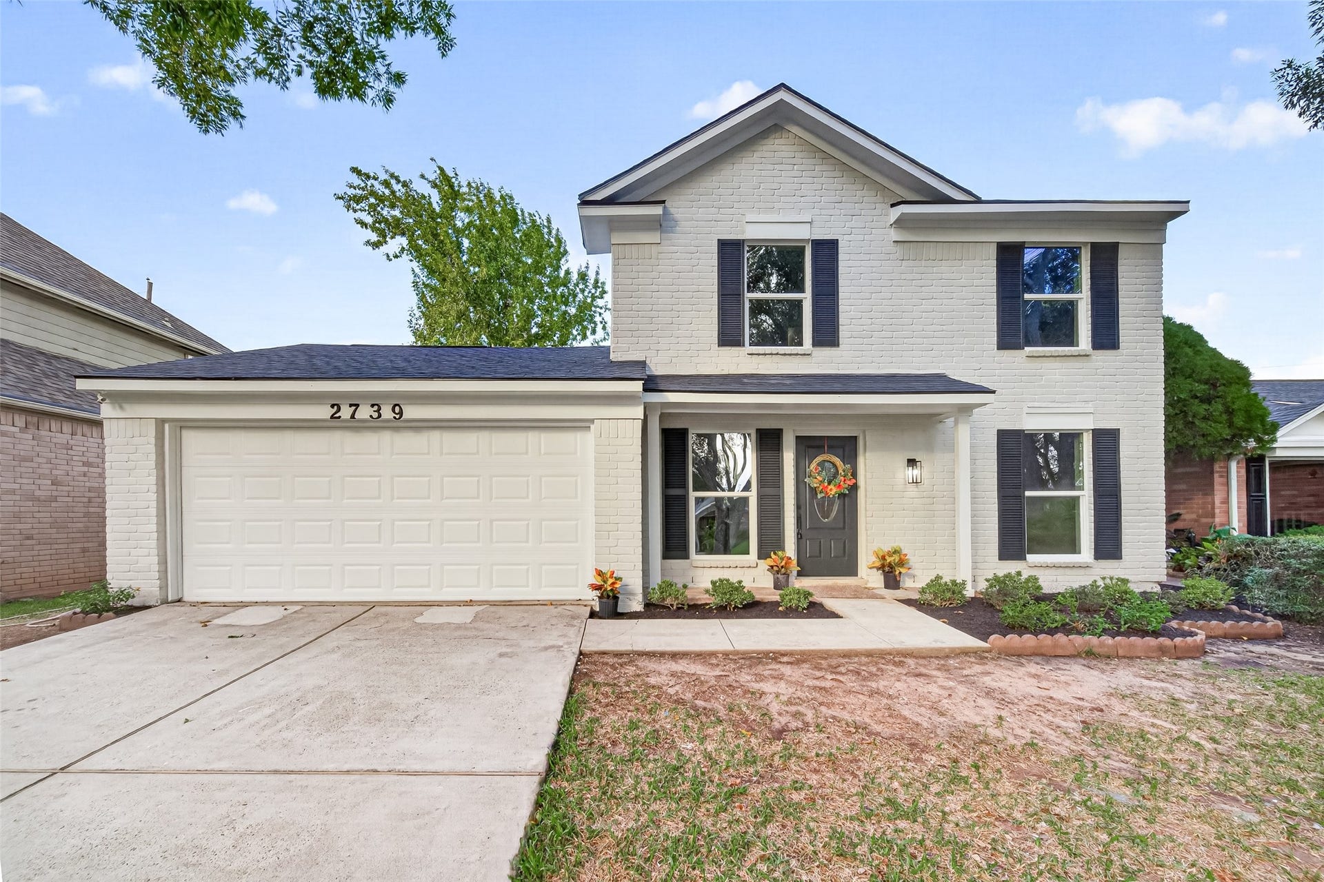 Beautiful curb appeal with fresh exterior paint, new roof, new windows & shutters as well as siding