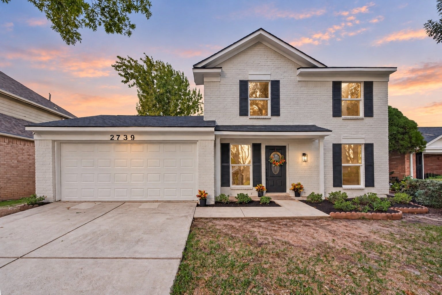 Beautiful curb appeal with fresh exterior paint, new roof, new windows & shutters as well as siding