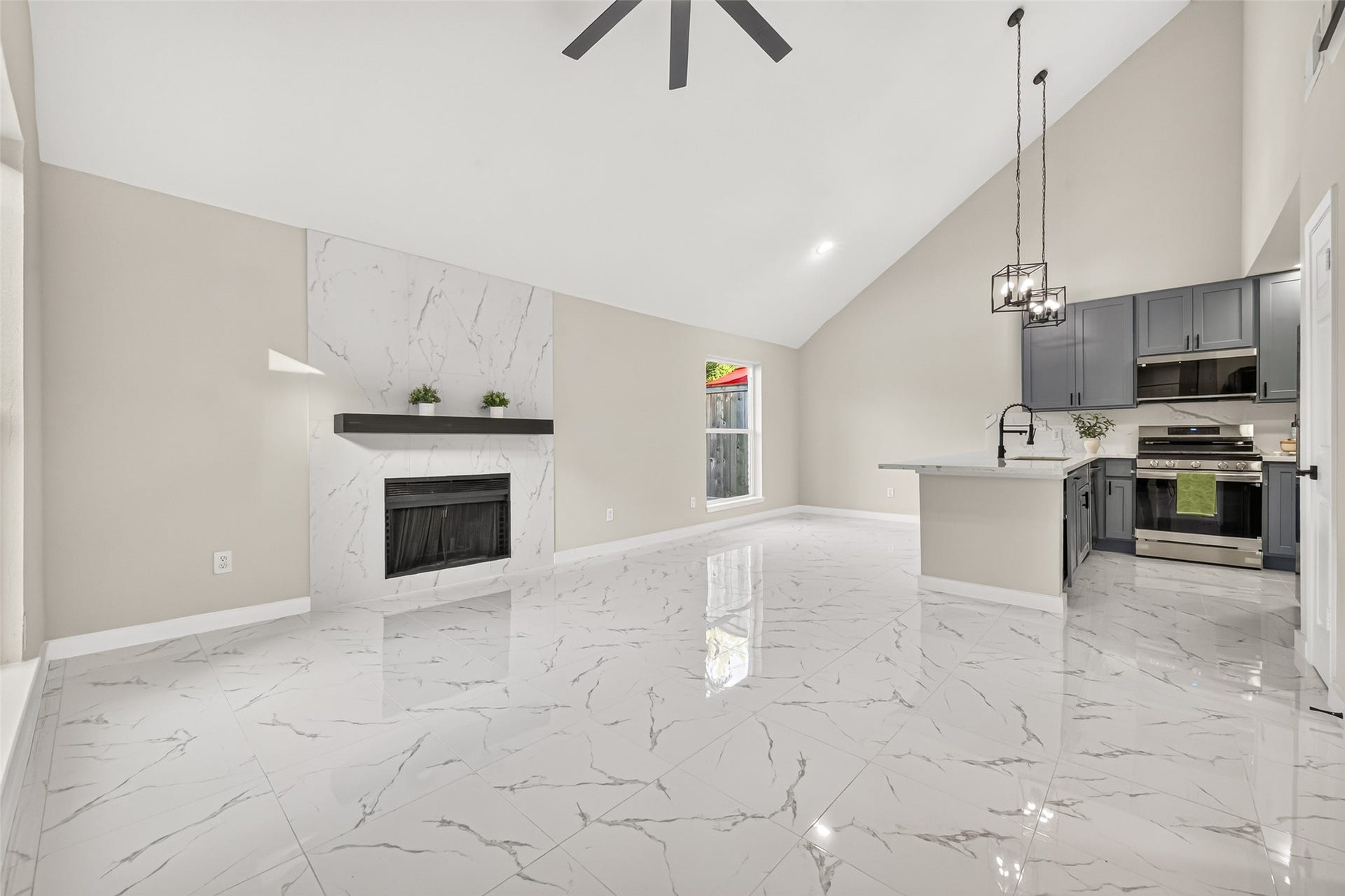 Open floor plan with high ceiling & lots of natural light