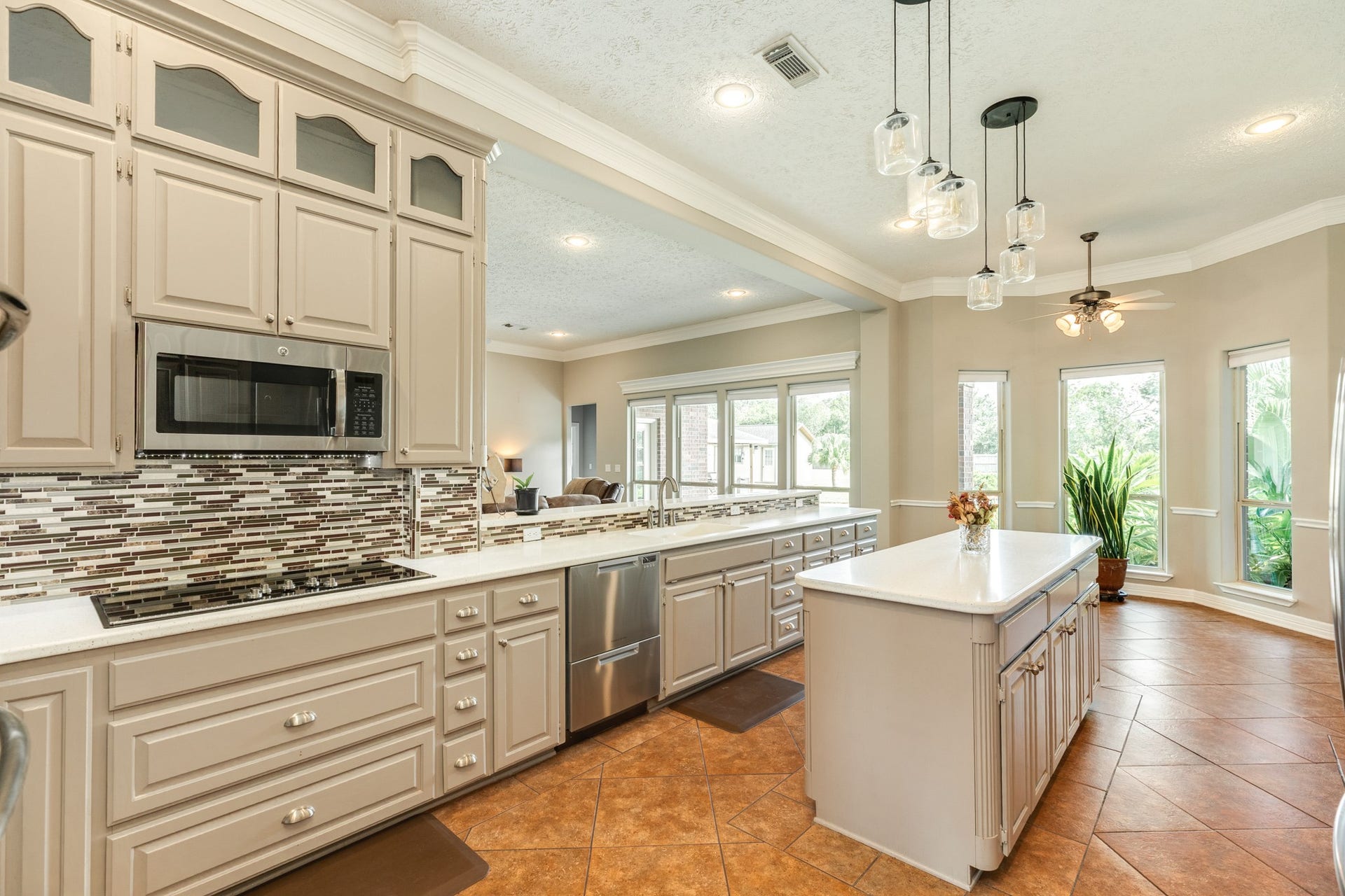 16337 County Road 171, Danbury, TX 77534 This kitchen is made for both style and function, featuring a new cooktop installed in 2024, a double-drawer dishwasher, and a large center island.