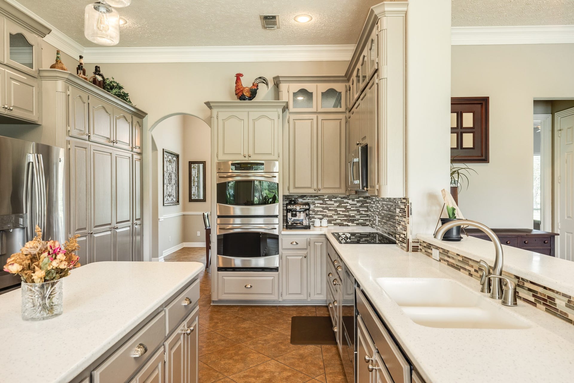 16337 County Road 171, Danbury, TX 77534 The well-designed kitchen features custom cabinetry and generous counter space, along with large double ovens and a refrigerator replaced in 2018.