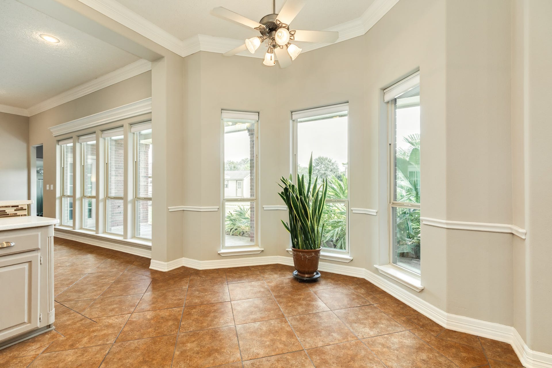 16337 County Road 171, Danbury, TX 77534 The breakfast area features a charming bay of windows overlooking the property, creating an inviting setting for casual dining just off the kitchen.