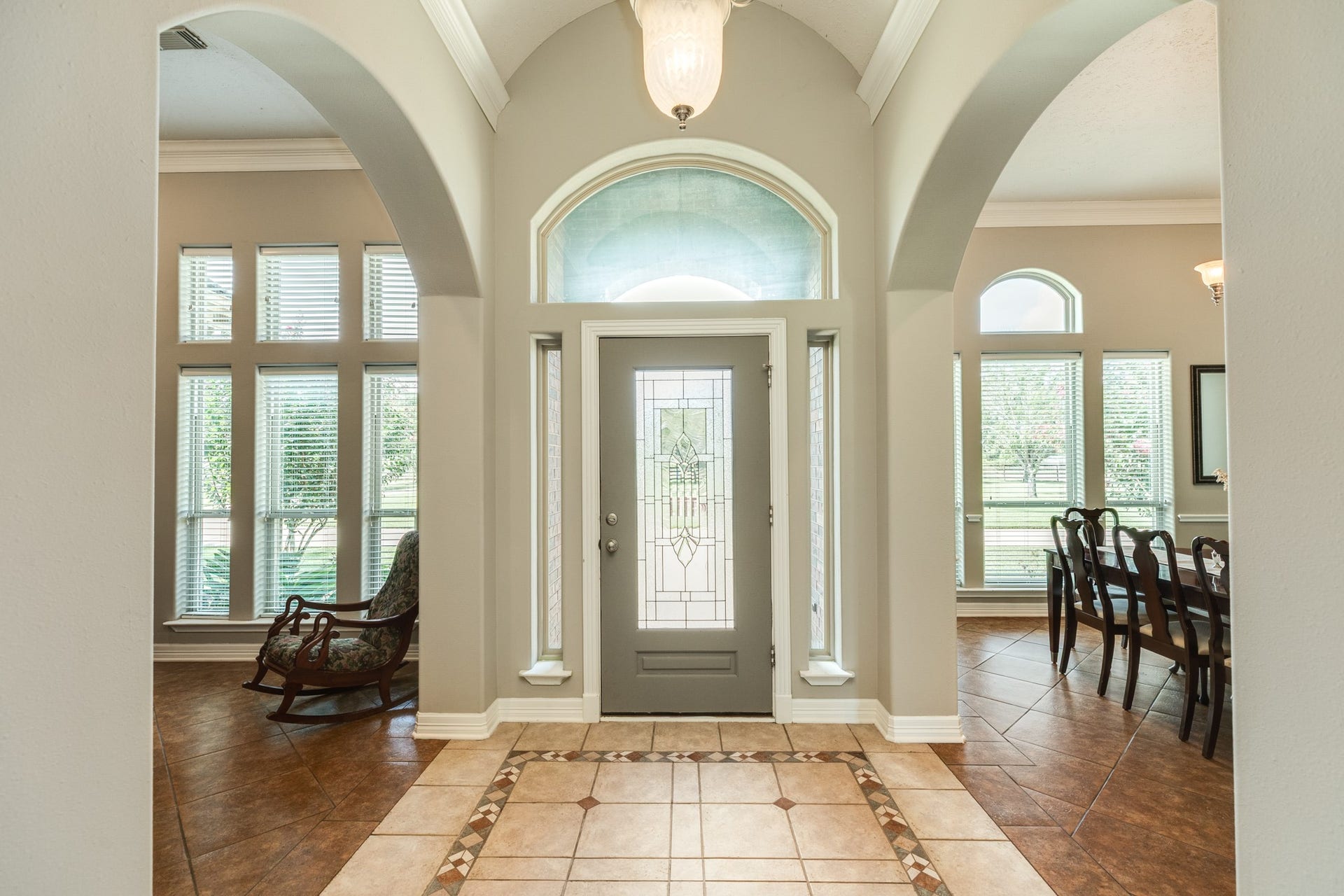 16337 County Road 171, Danbury, TX 77534 A grand, light-filled entryway welcomes you with soaring ceilings, graceful archways, elegant architectural details, and a beautiful statement front door.