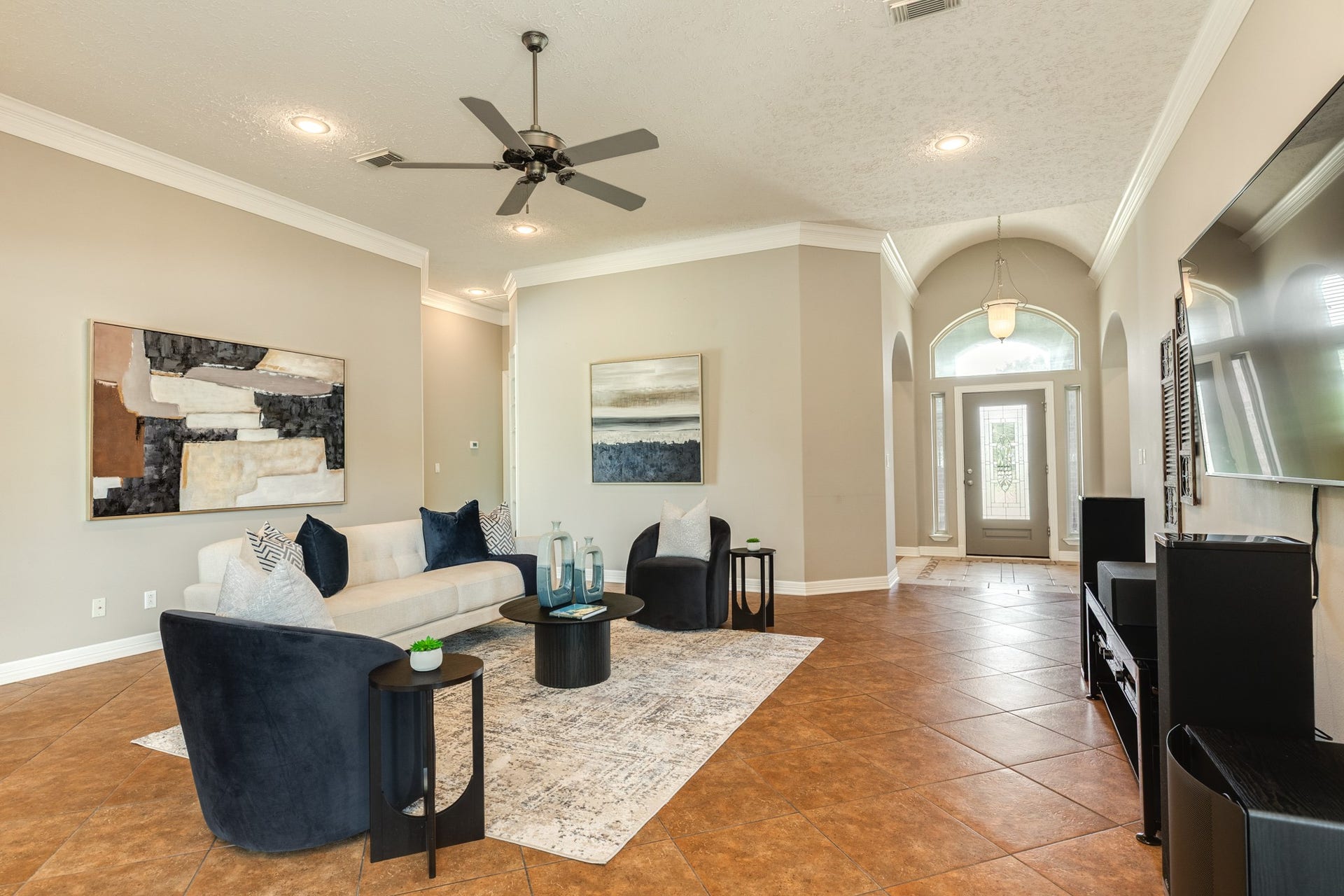 16337 County Road 171, Danbury, TX 77534 A spacious front living area just off the entry offers soaring ceilings, crown molding, and an open, inviting layout, an elegant space for welcoming guests and entertaining in style.