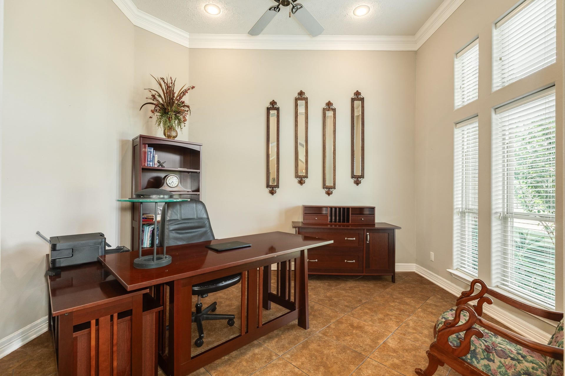 16337 County Road 171, Danbury, TX 77534 A versatile flex space offers endless possibilities as a private home office, study, or sitting room, complete with high ceilings and large windows.