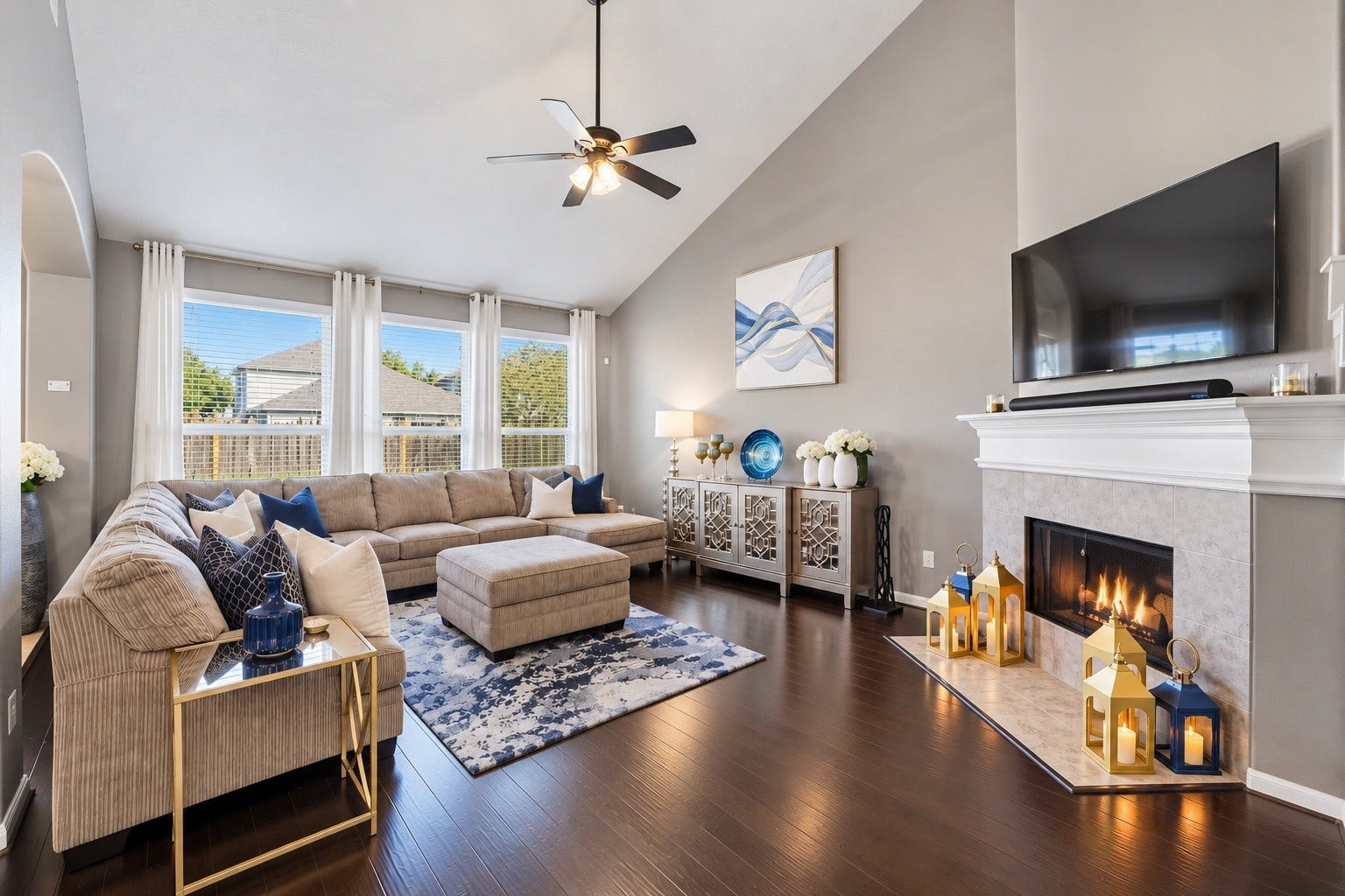 The warm family room is spacious, has tons of natural light and soaring ceilings. Nestle around the fireplace on those chilly fall nights.