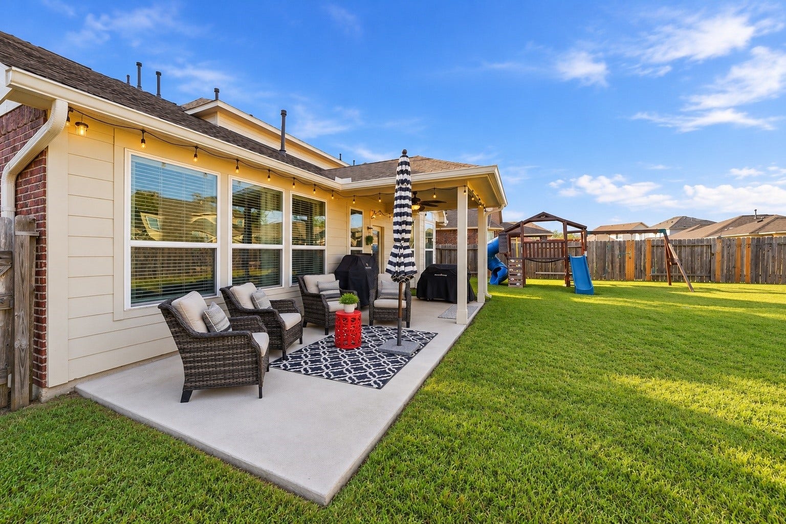 Extended patio is naturally shaded by the house