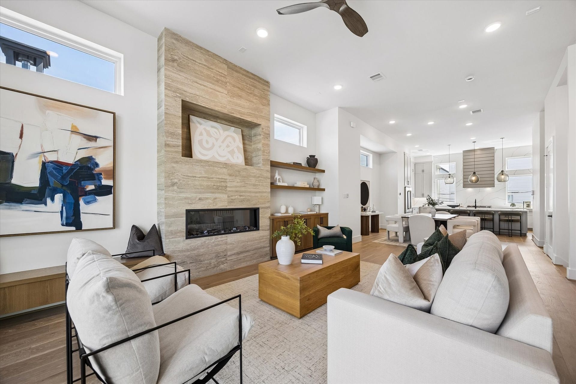 Another view of this incredible living room showing the seamless flow with the kitchen and dining areas; perfect for entertaining & everyday living.