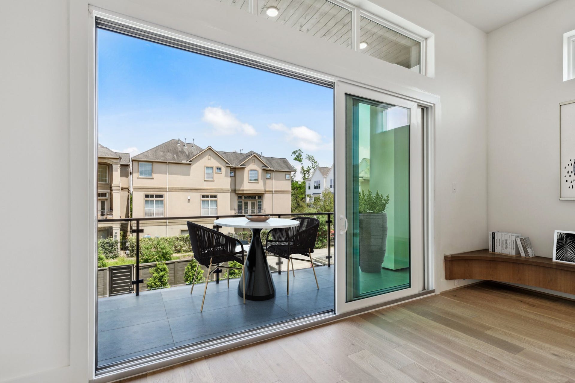This spacious 2nd floor balcony offers plenty of room for an outdoor table & chairs and grill; while overlooking your large yard. Note this photo has been virtually staged.