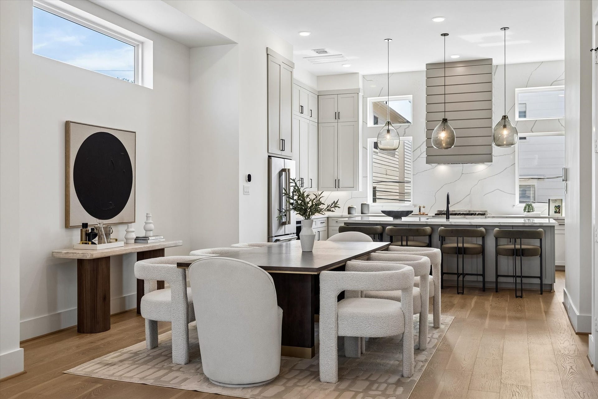 Another view of this wonderful formal dining room, built for entertaining. To the right is a hallway to the stylish half bath. The door to the right opens to the elevator ready shaft which currently serves as an oversized storage. closet.