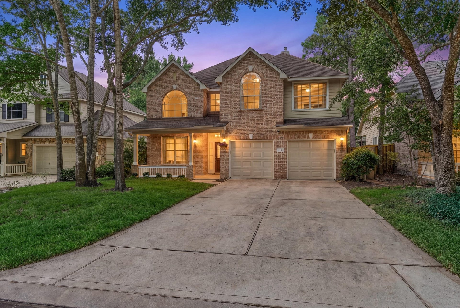 11 Vinca Trail, The Woodlands, TX 77382 The home has a spacious dowble wide driveway and can accommodate a lot of cars.