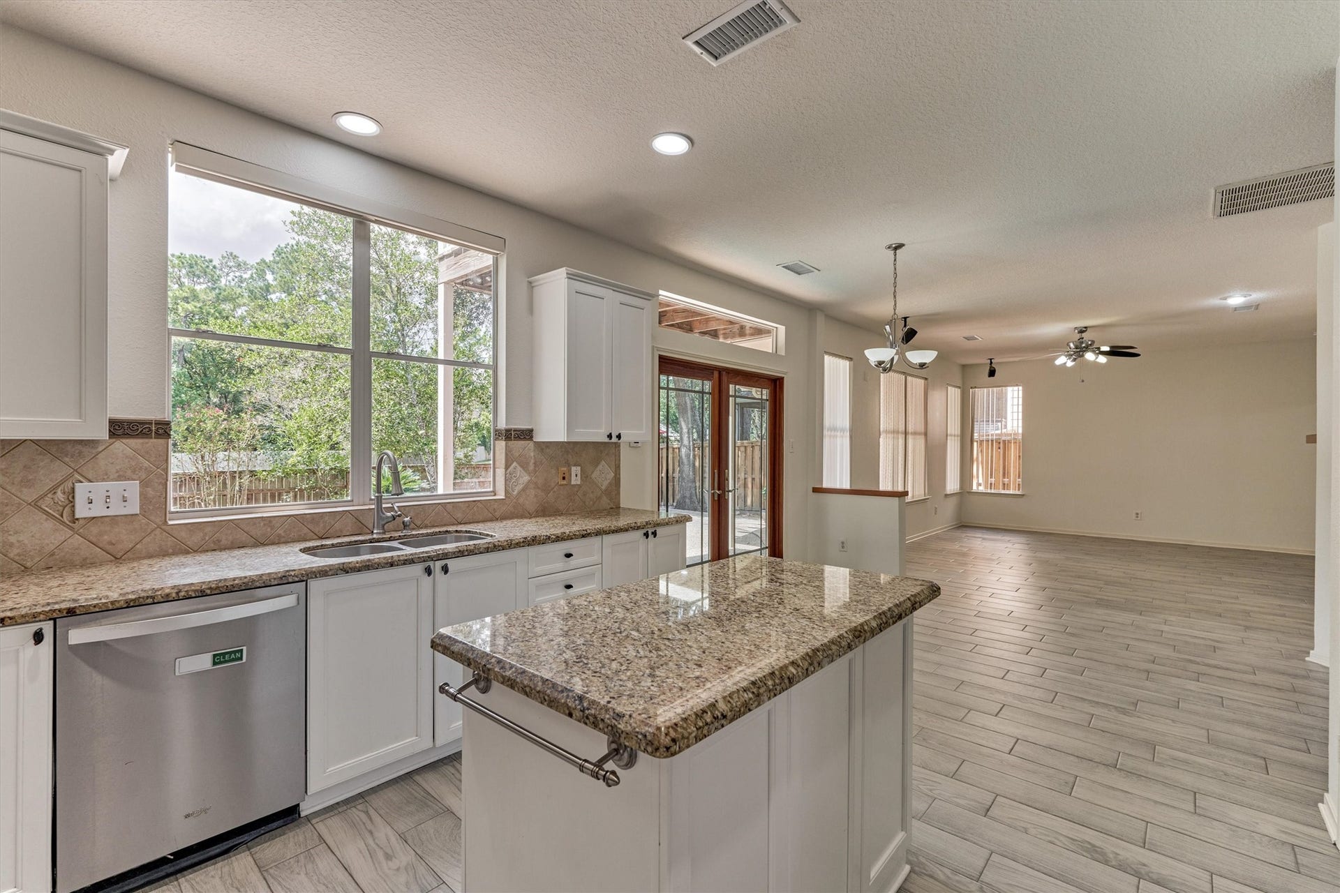 11 Vinca Trail, The Woodlands, TX 77382 The home is bright and inviting and ready for move in. Enjoy cooking in this kitchen with some tranquil views to your backayrd.