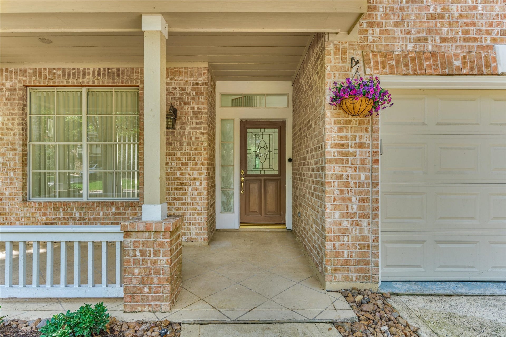 11 Vinca Trail, The Woodlands, TX 77382 The front covered entryway of the home.
