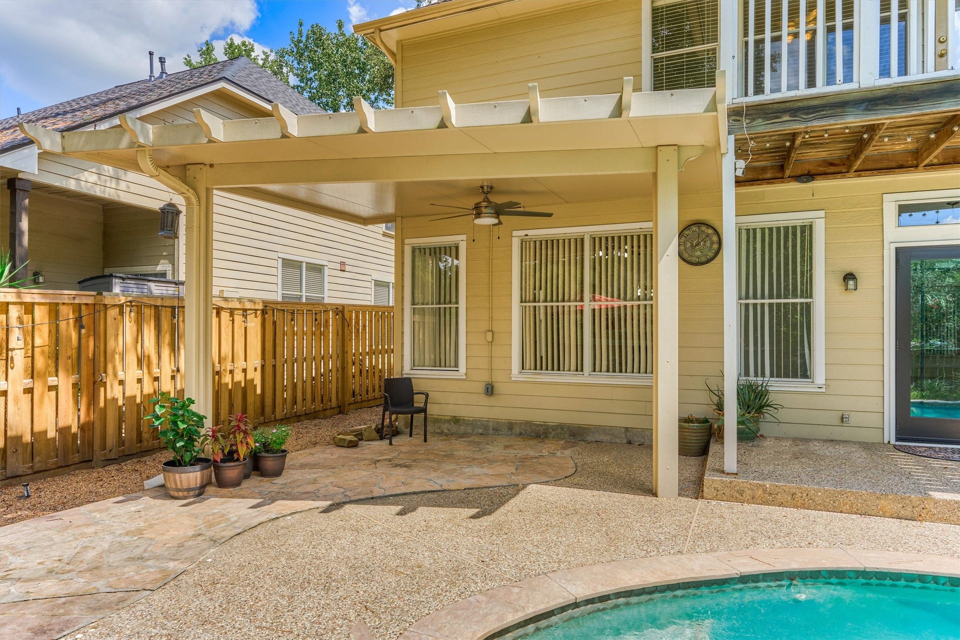 11 Vinca Trail, The Woodlands, TX 77382 The backyard covered patio is the perfect place for outdoor dining poolside.