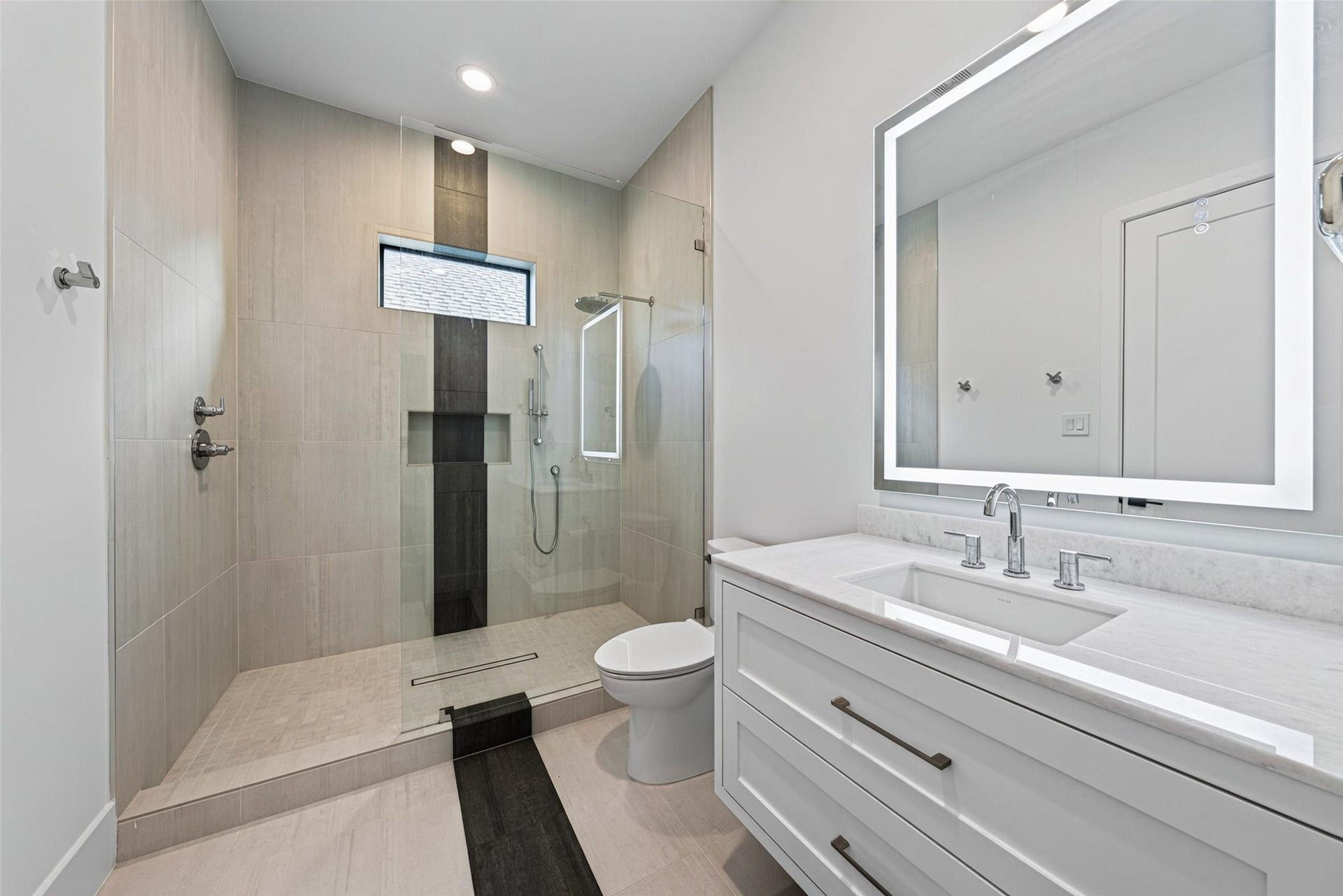 1716 Driscoll Street, Houston, TX 77019 The 3rd and 4th secondary bedrooms have oversized walk in showers. All have designer bath finishes, with LED/Wi-Fi-capable, anti-fog mirrors.