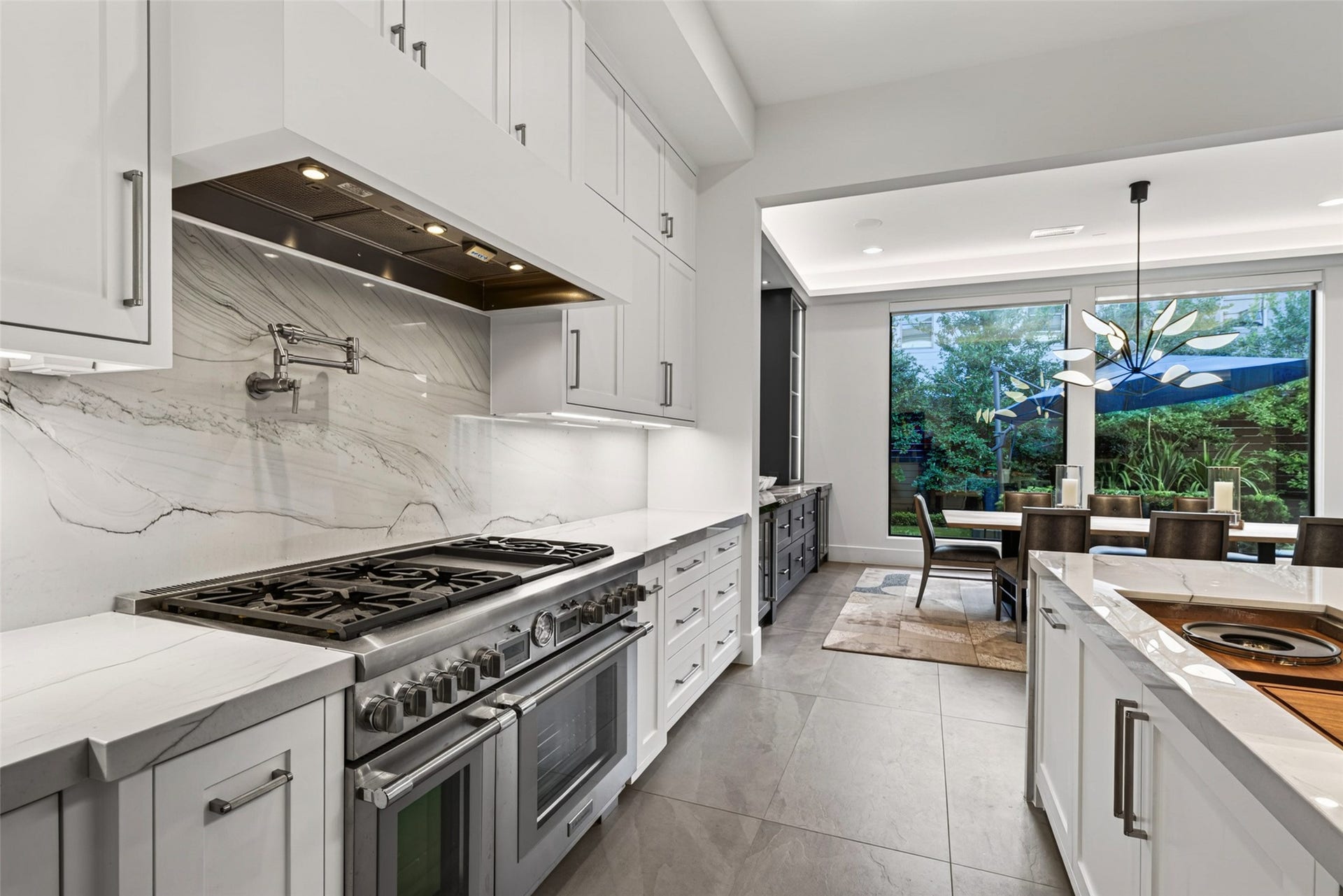 1716 Driscoll Street, Houston, TX 77019 A Thermador six burner with griddle and double ovens add to this chef style kitchen.