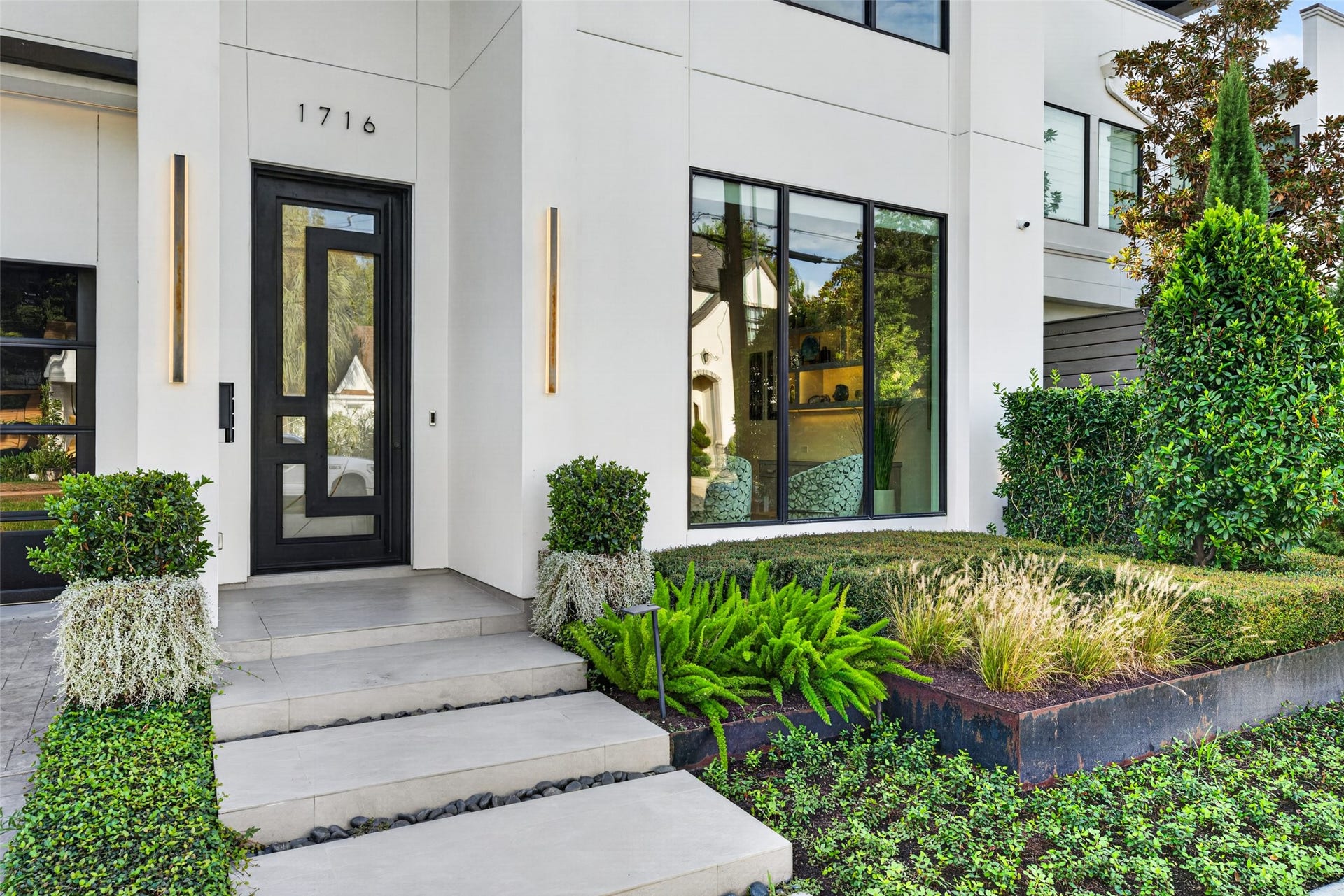 1716 Driscoll Street, Houston, TX 77019 The facade of the home is framed with low maintenance landscaping and irrigation system.
