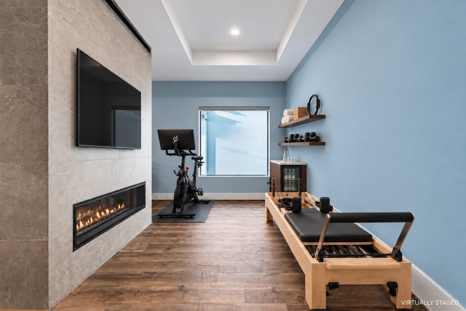 1716 Driscoll Street, Houston, TX 77019 A private space for movement and renewal, envisioned within the primary suite. This virtually rendered pairs a Peloton and Pilates reformer with a beverage station. This flex space can accommodate many options.
Virtually staged for inspiration. Equipment, furnishings, shelving, beverage fridge, and TV are not existing features.