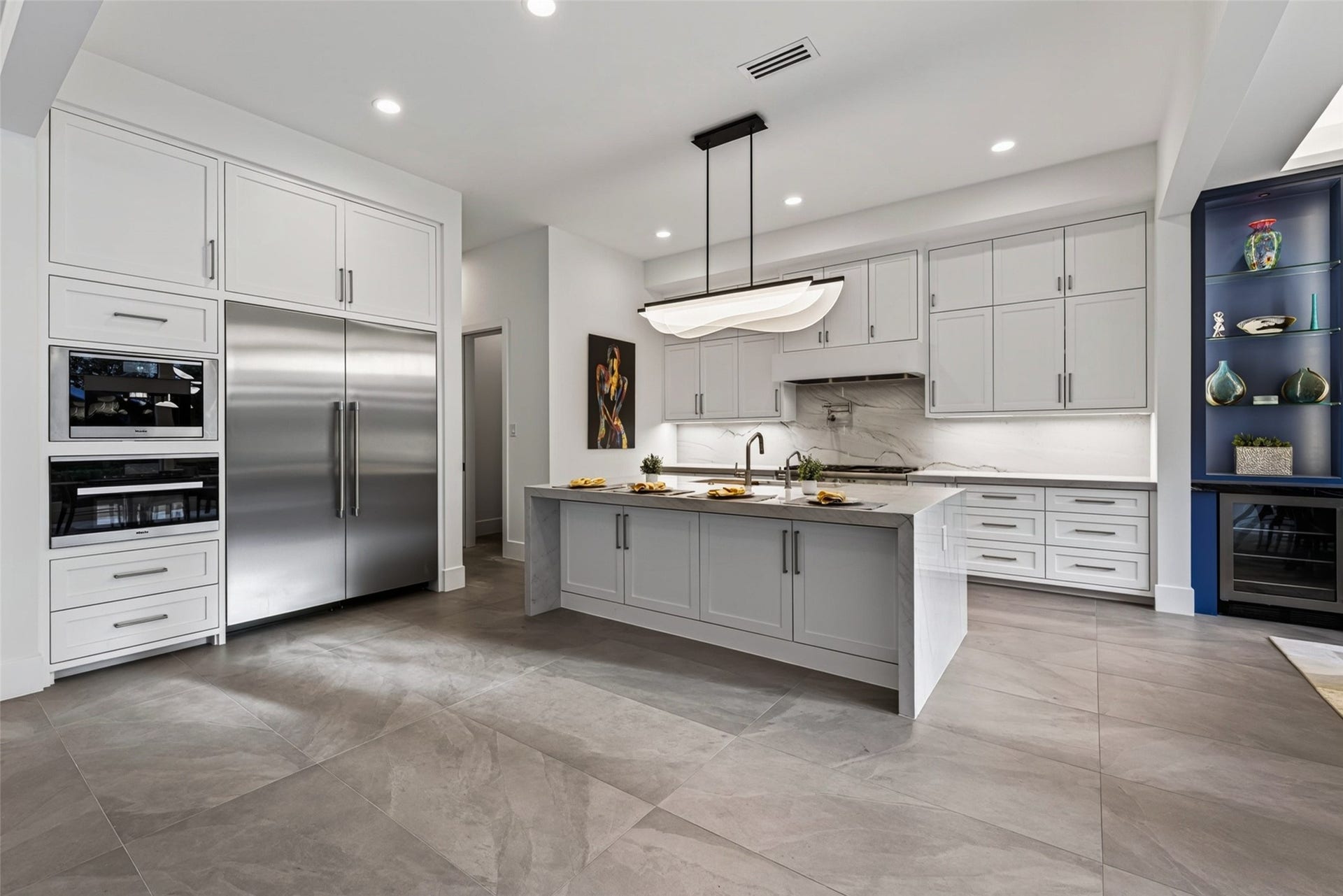 1716 Driscoll Street, Houston, TX 77019 The kitchen features separate tower Thermador refrigerator and freezer, and the Miele speed oven and built in coffee systems are fabulous for entertaining.