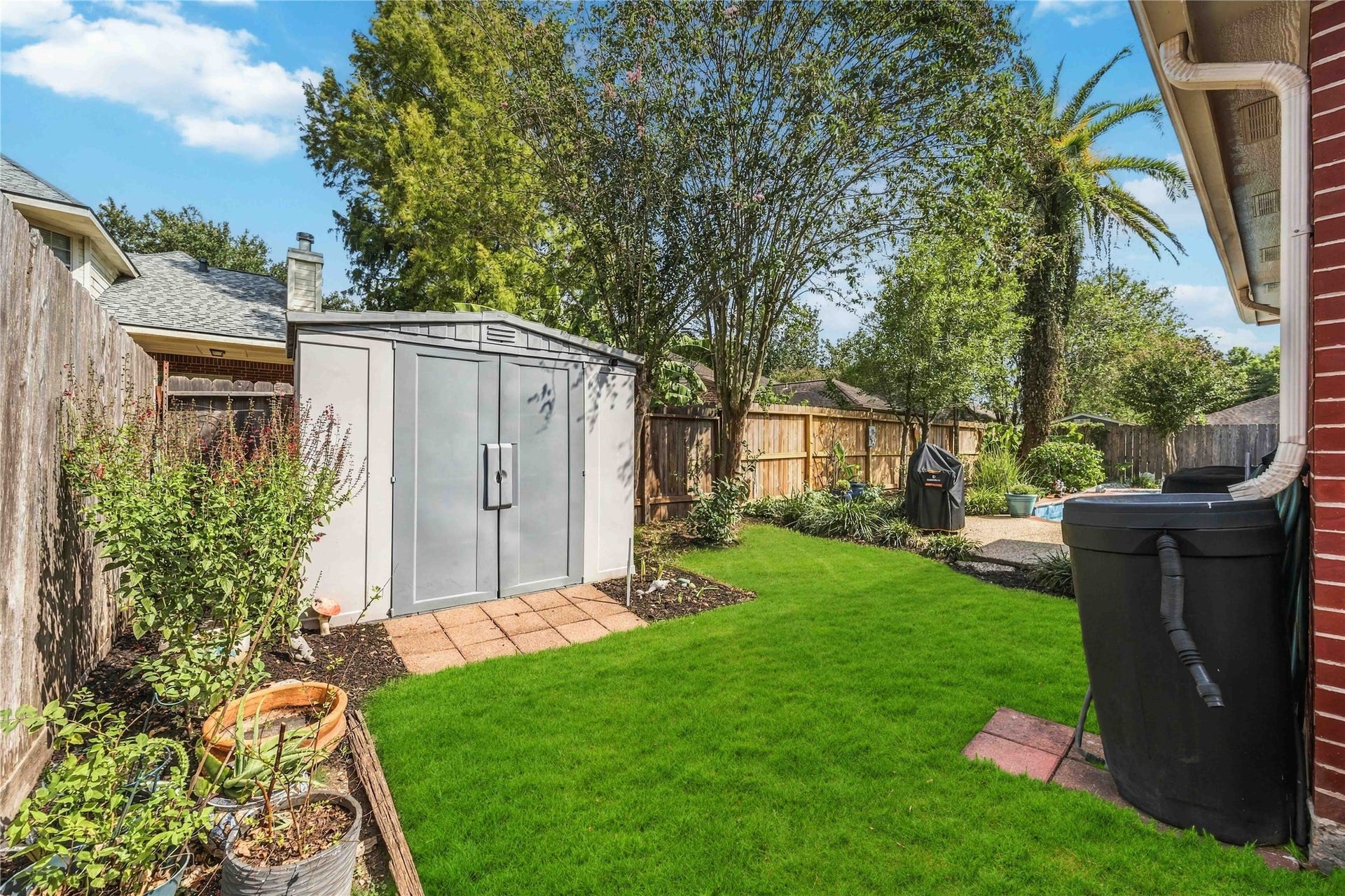 4118 Laurette Court, Sugar Land, TX 77479 Convenient storage shed provides plenty of space for gardening tools and outdoor equipment.