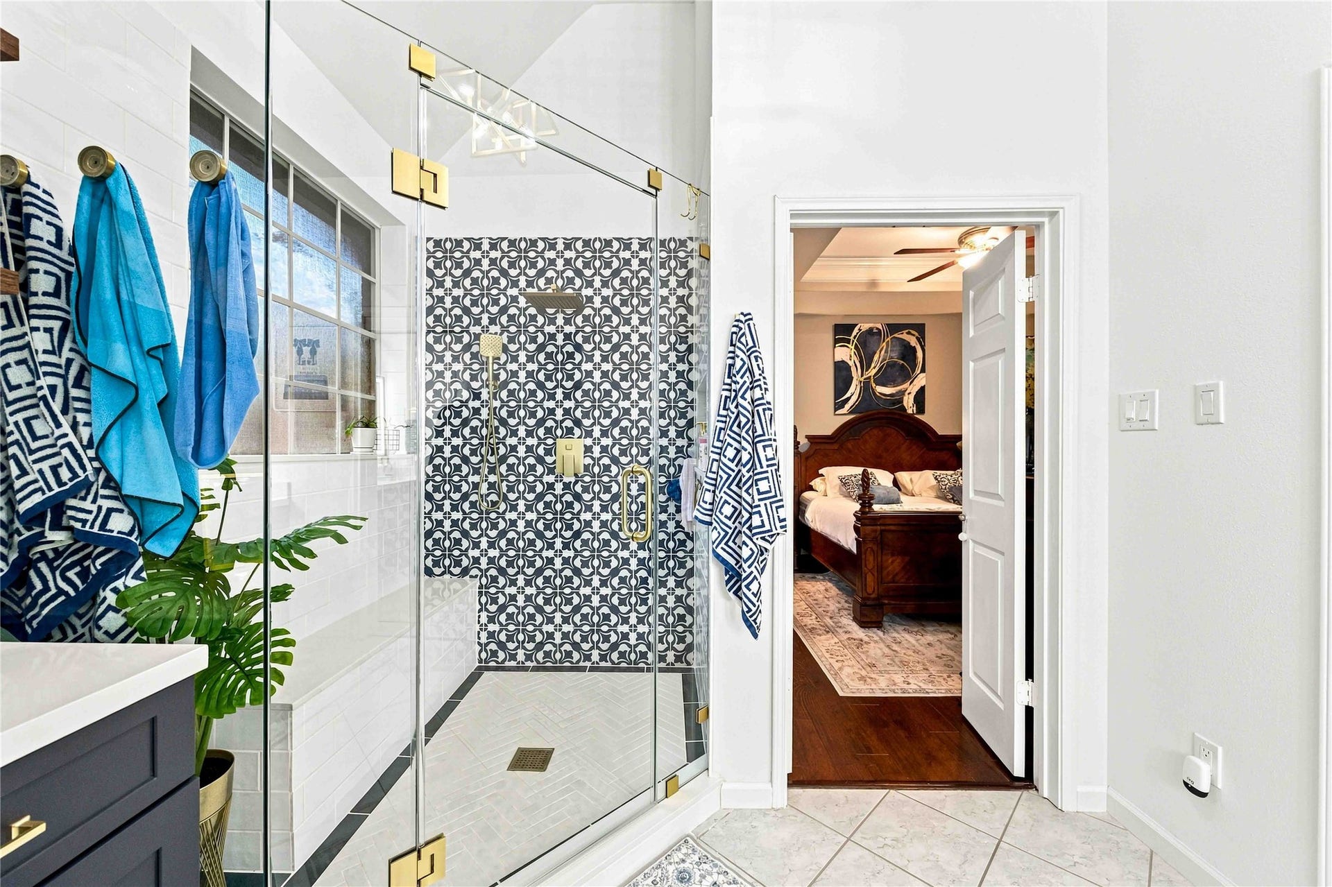 4118 Laurette Court, Sugar Land, TX 77479 Custom walk-in shower featuring a built-in bench for added comfort and convenience.