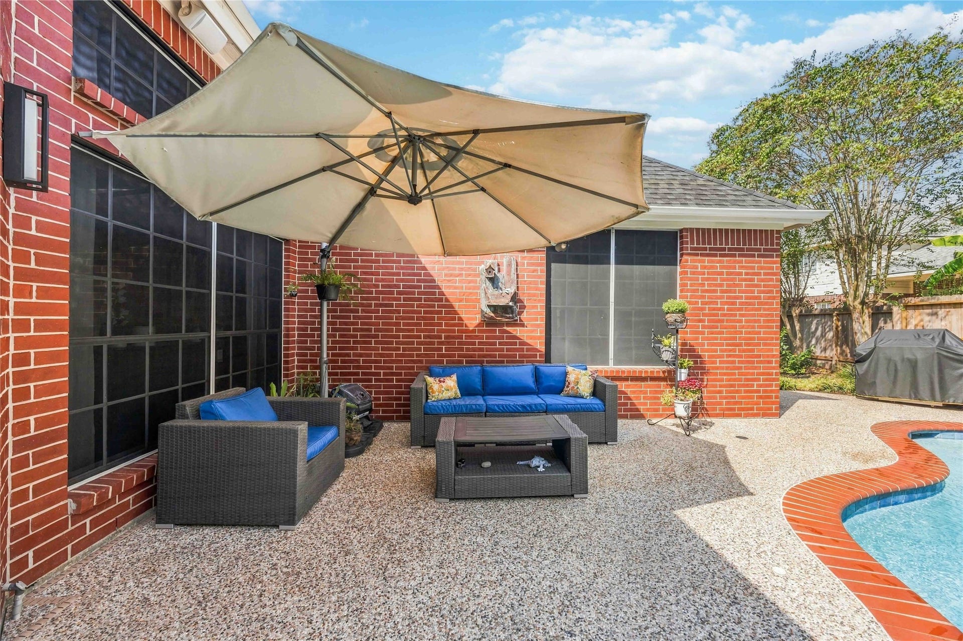 4118 Laurette Court, Sugar Land, TX 77479 A cozy patio provides the perfect spot to relax and unwind.