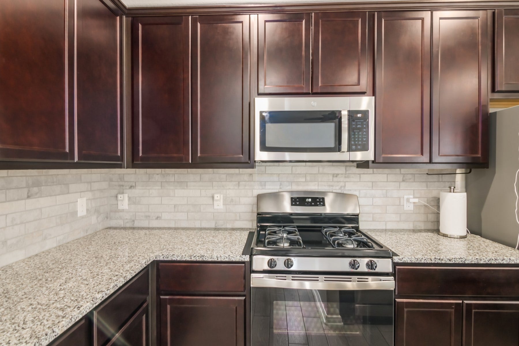 517 N 6th Street, La Porte, TX 77571 Rich cabinetry, sleek countertops, and stainless steel appliances create a refined kitchen space.