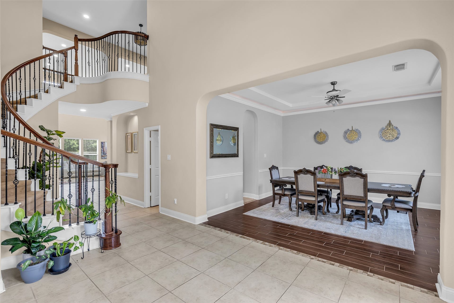 3314 Sussex Way, Friendswood, TX 77546 From the foyer, the view to the right showcases the dining room, the staircase leading upstairs, and a glimpse of the family room beyond.