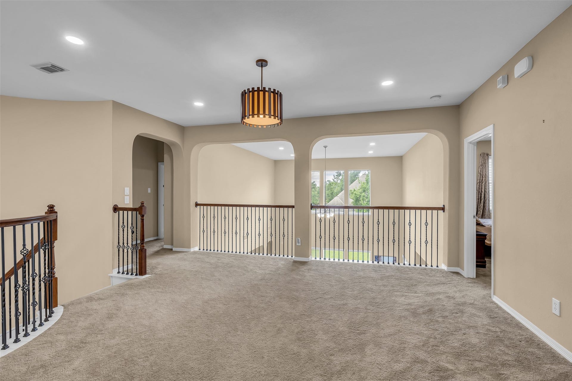 3314 Sussex Way, Friendswood, TX 77546 On the second floor, this hallway overlooks the living room below, adding an open and connected feel to the home.
